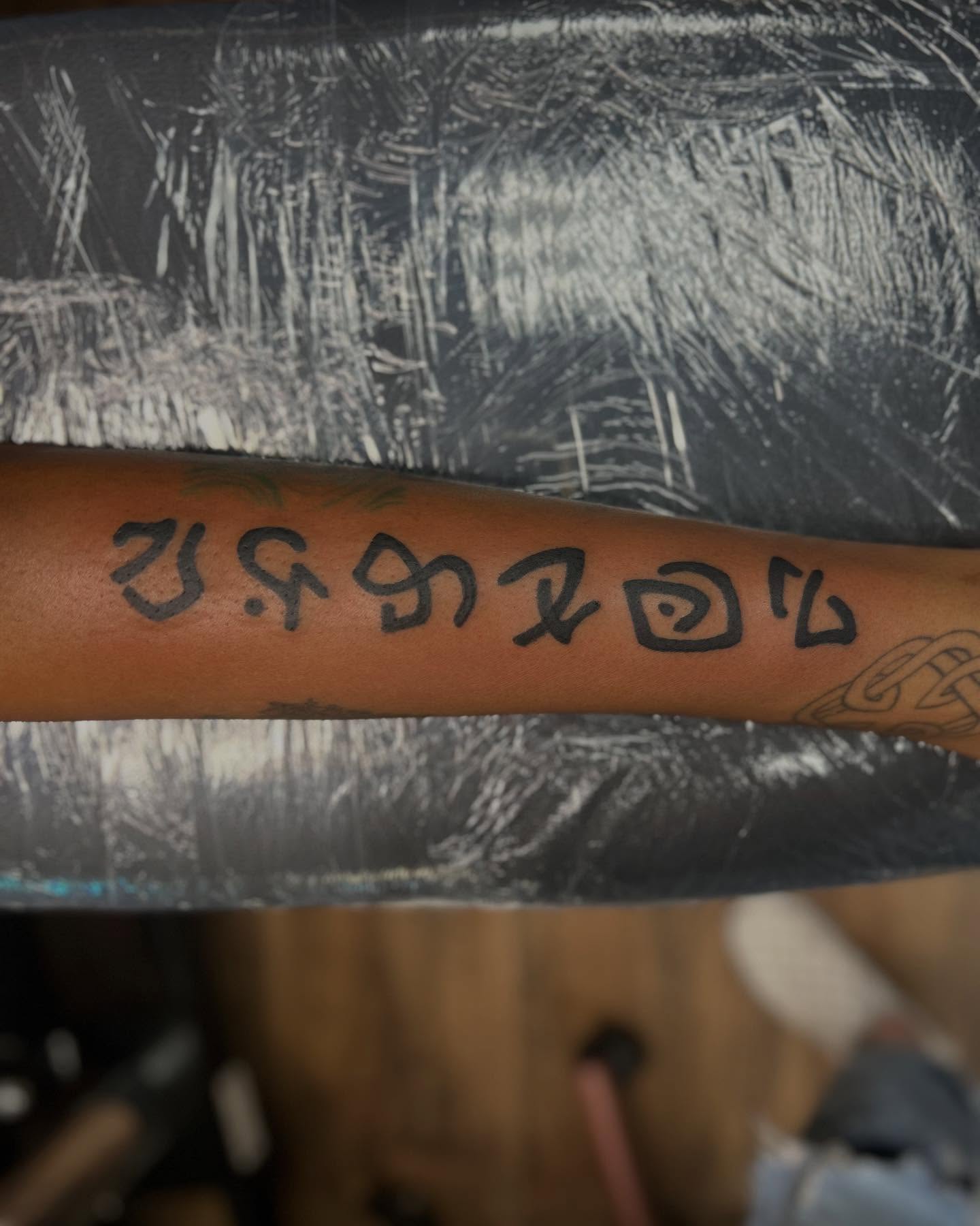 Korean phrase lettering script tattoo on the forearm by Abby Camacho - Tattoo Artist and Piercer โจ๐
