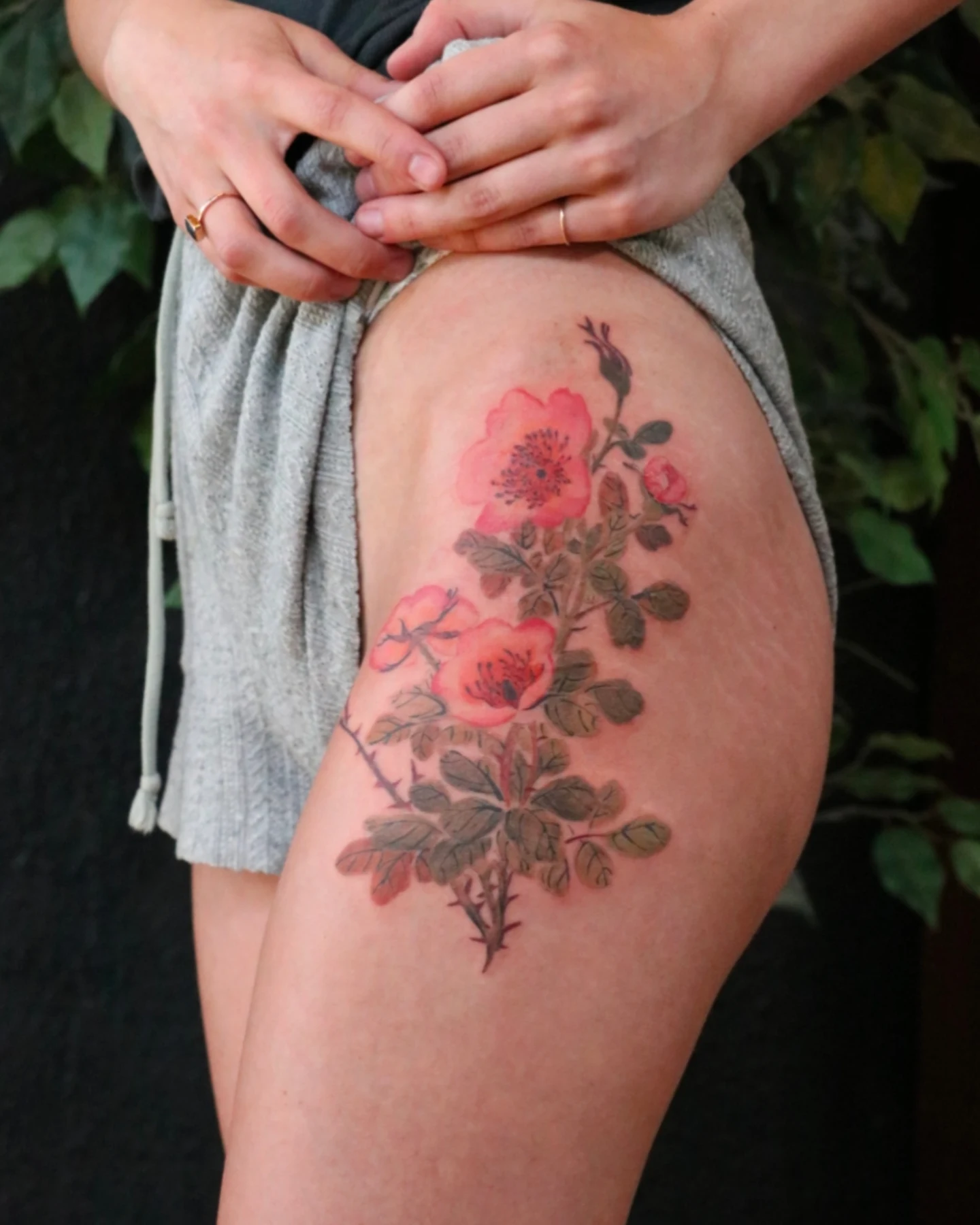 Flower bouquet realism tattoo on the thigh by Jhenn