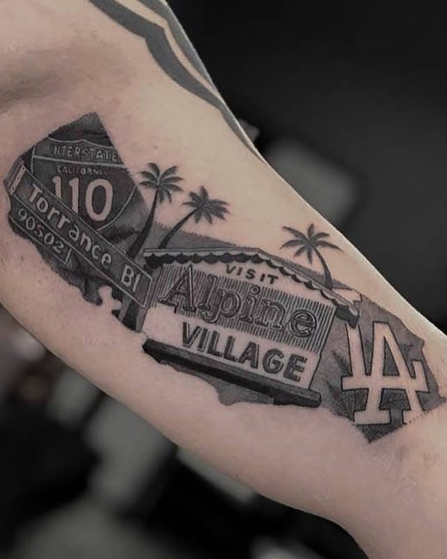 Highway sign black and grey tattoo on the forearm by Johnson