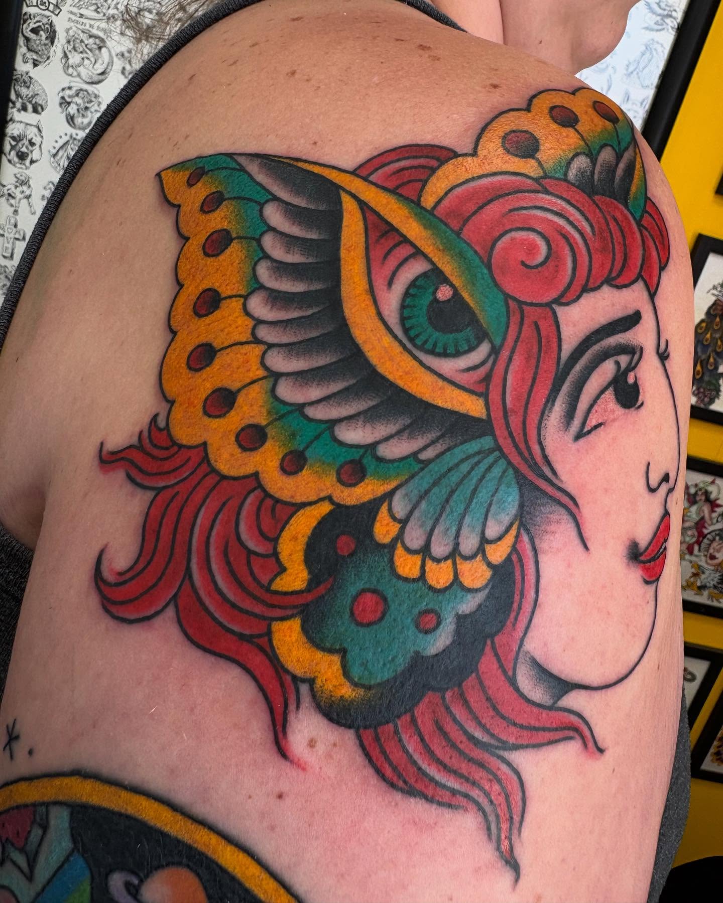 Woman's head American traditional tattoo on the shoulder by Zach Hendrickson