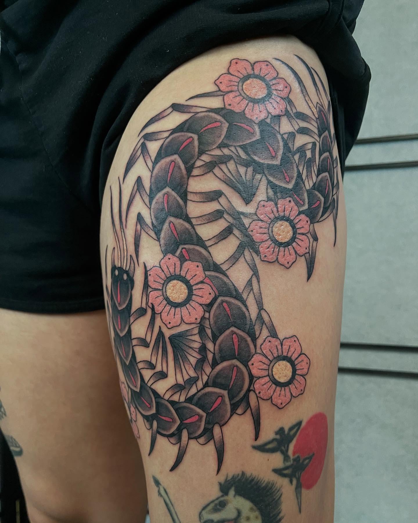 Serpent and flowers American traditional tattoo on the thigh by Seattle Tattoo Artist, Bonney Lake, Washington