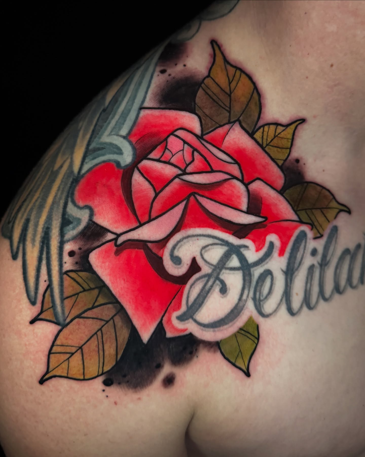 Red rose with wings American traditional tattoo on the shoulder by Ben Viamontes