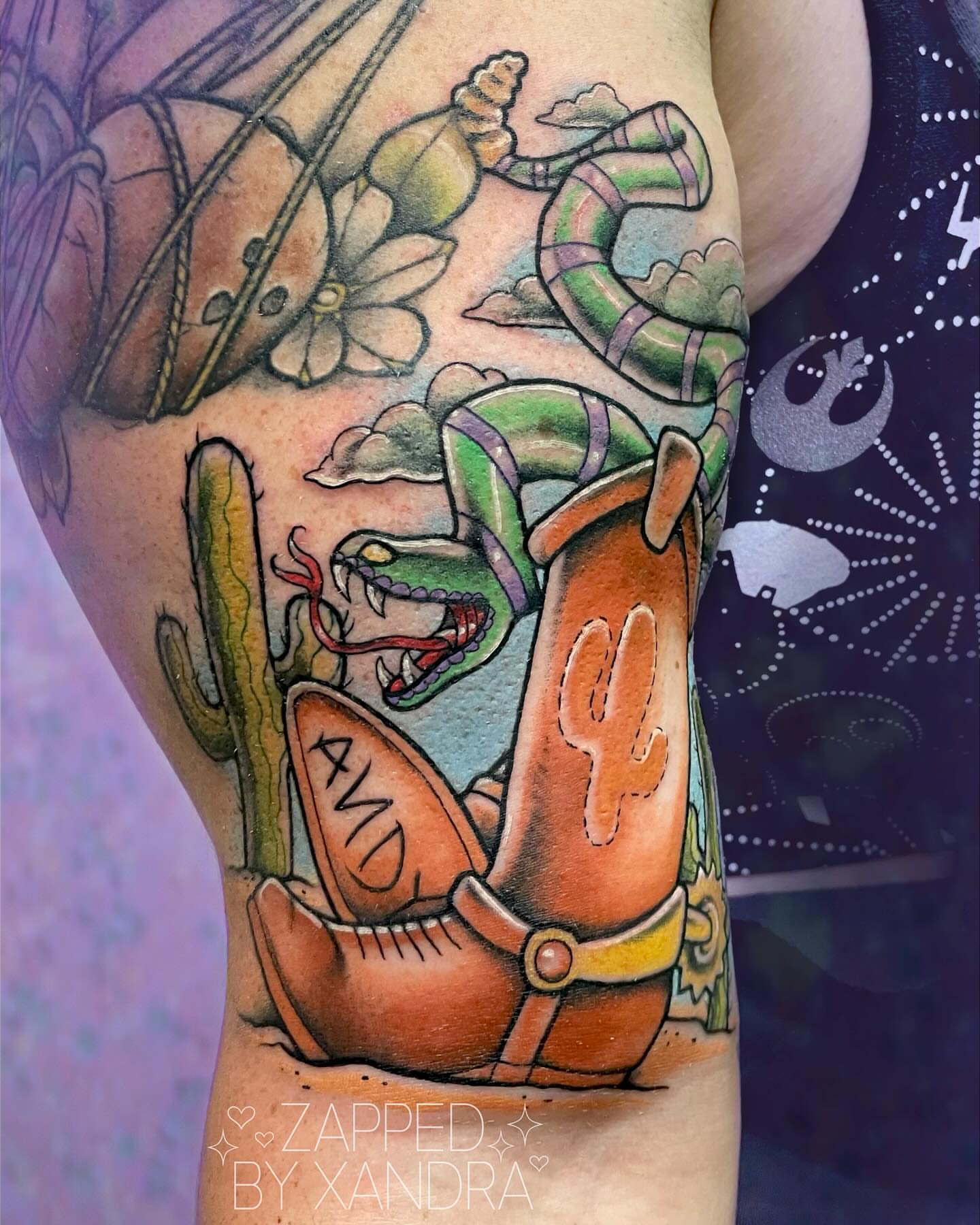 Cowboy boot and snake American traditional tattoo on the forearm by ๐๐ข๐ฏ๐ฅ๐ณ๐ข