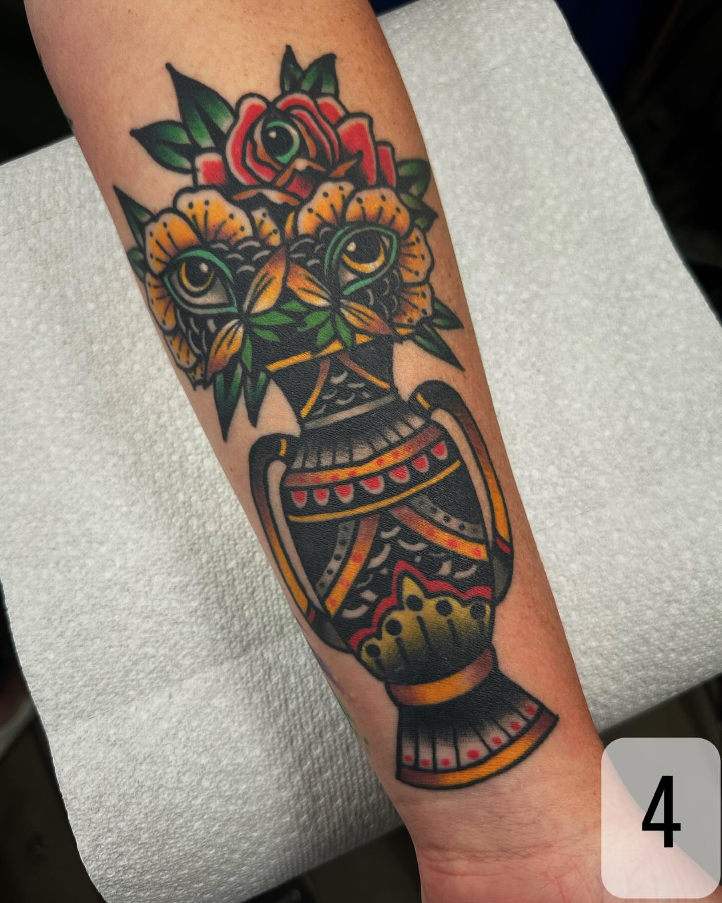 Vase with flowers American traditional tattoo on the forearm by Mikey Sarratt