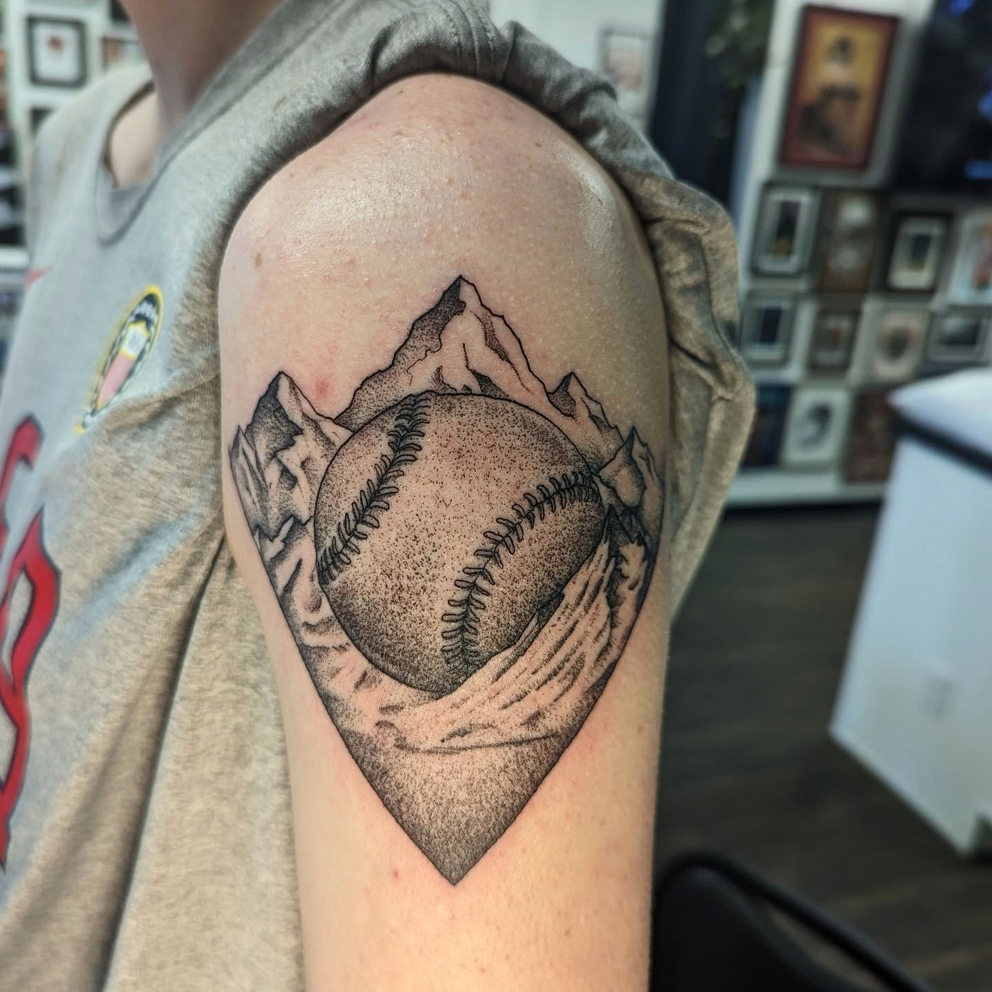Baseball and mountains dotwork tattoo on the shoulder by DONEL 📍Denver