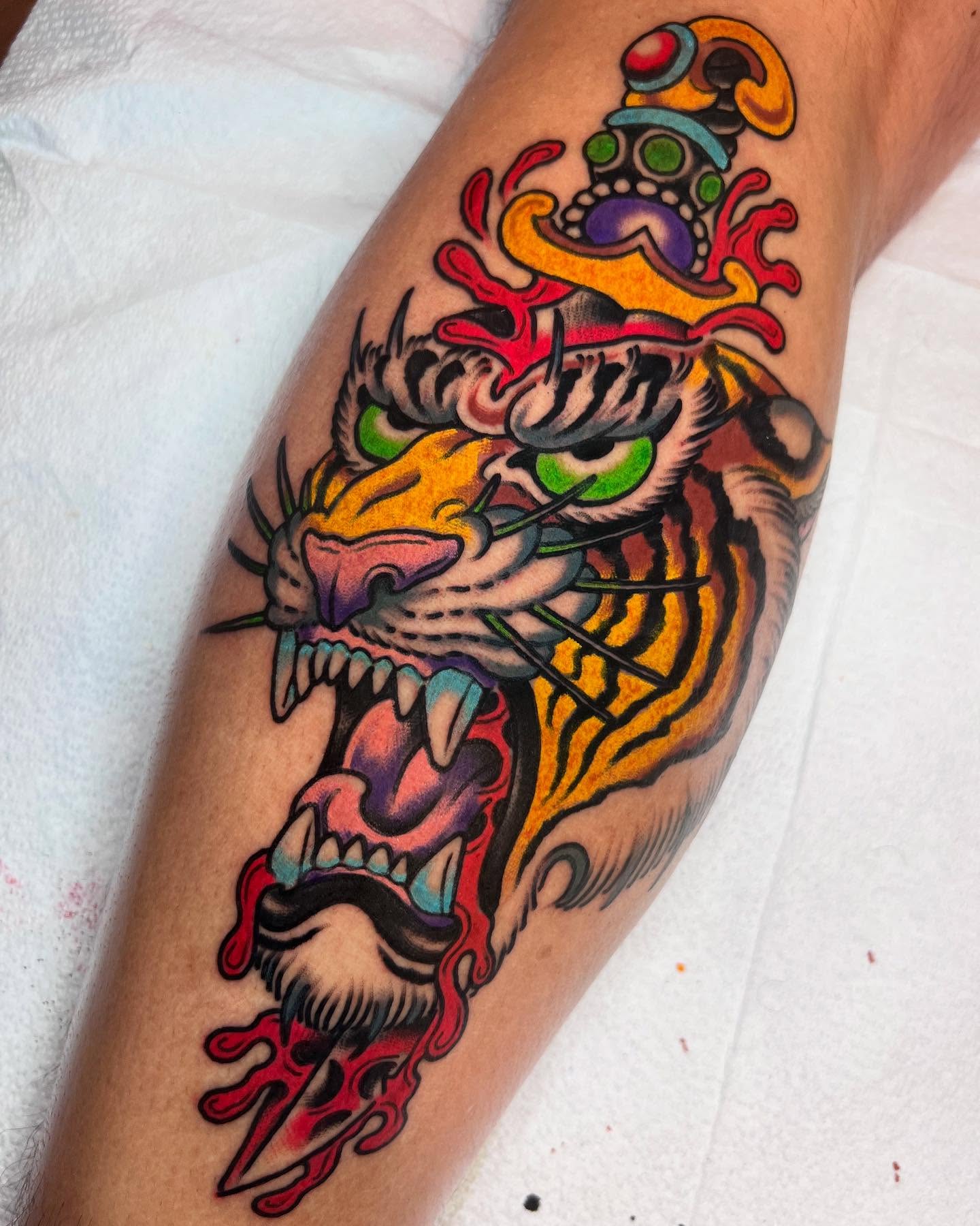 Tiger American traditional tattoo on the forearm by Barron