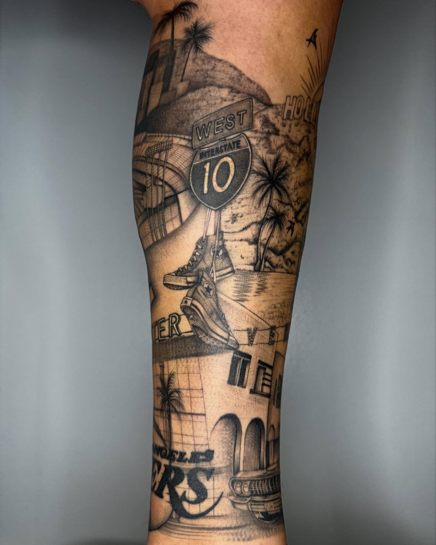 Hollywood sign black and grey tattoo on the forearm by Austin Tattoo Artist, Austin, Texas