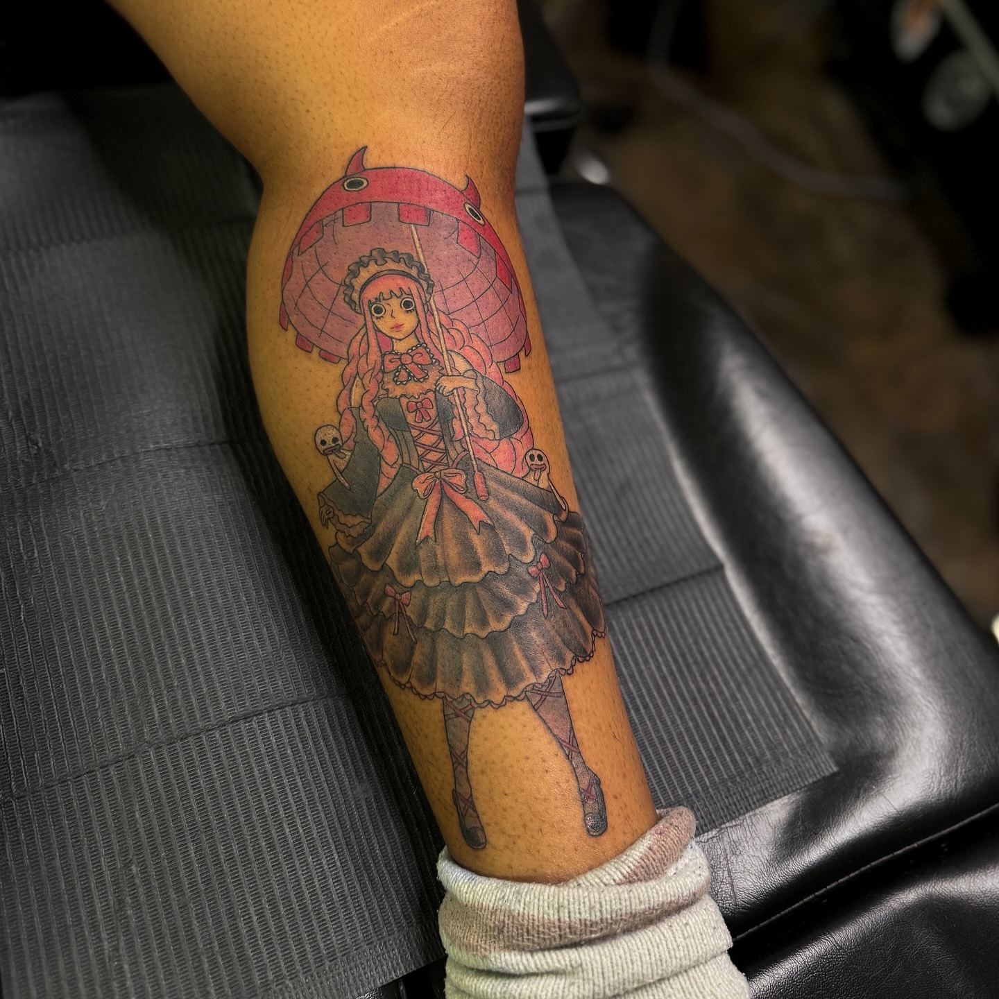 Anime girl with parasol anime tattoo on the forearm by Yohana Vargas