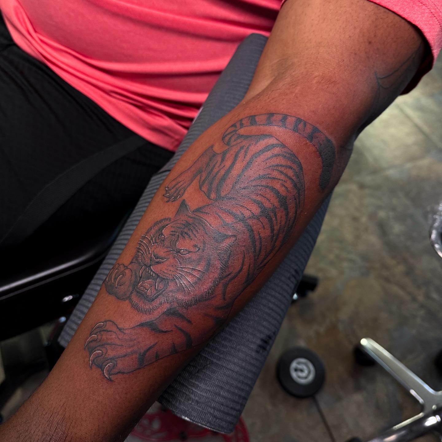 Roaring tiger realism tattoo on the forearm by Yohana Vargas