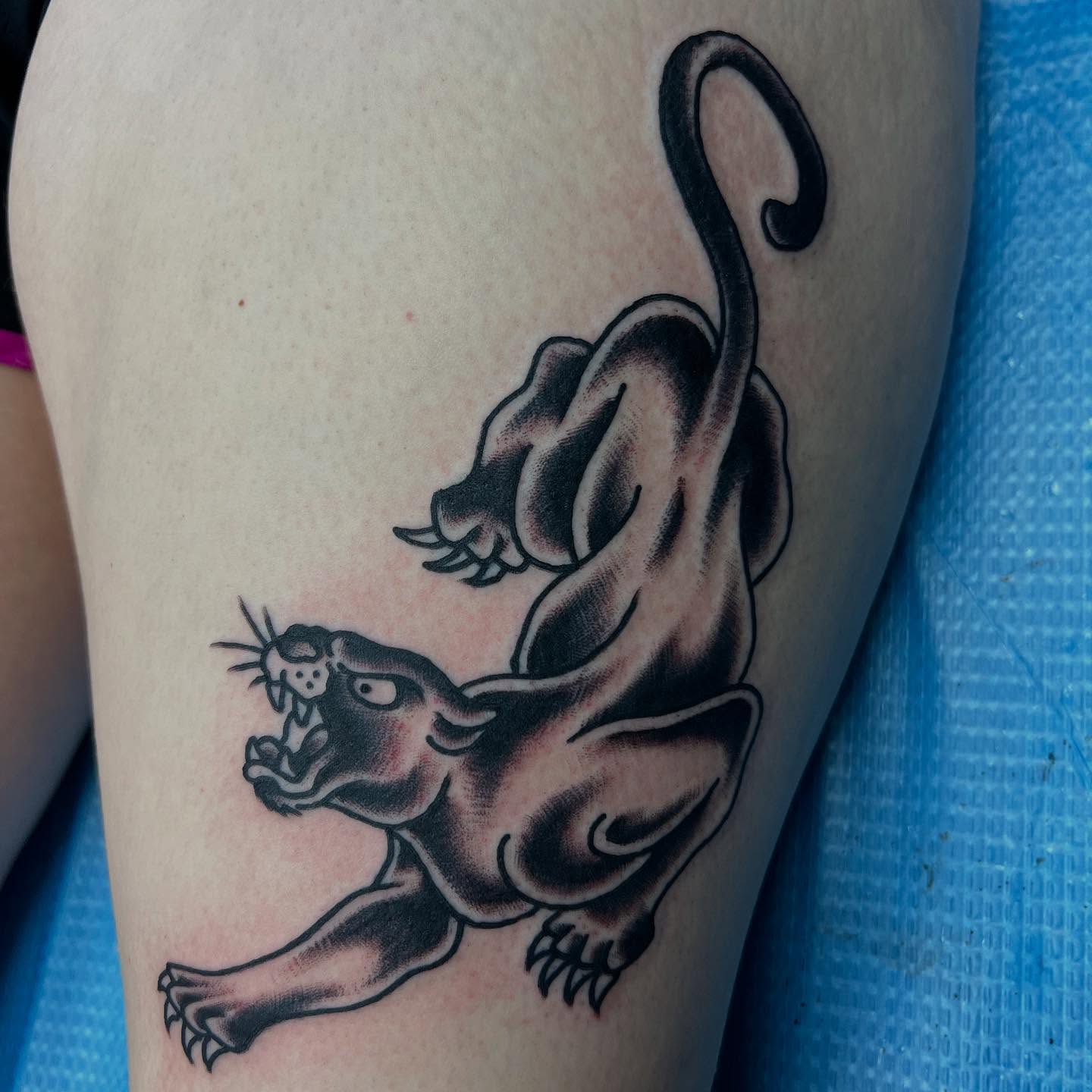 Panther black and grey tattoo on the thigh by doodle