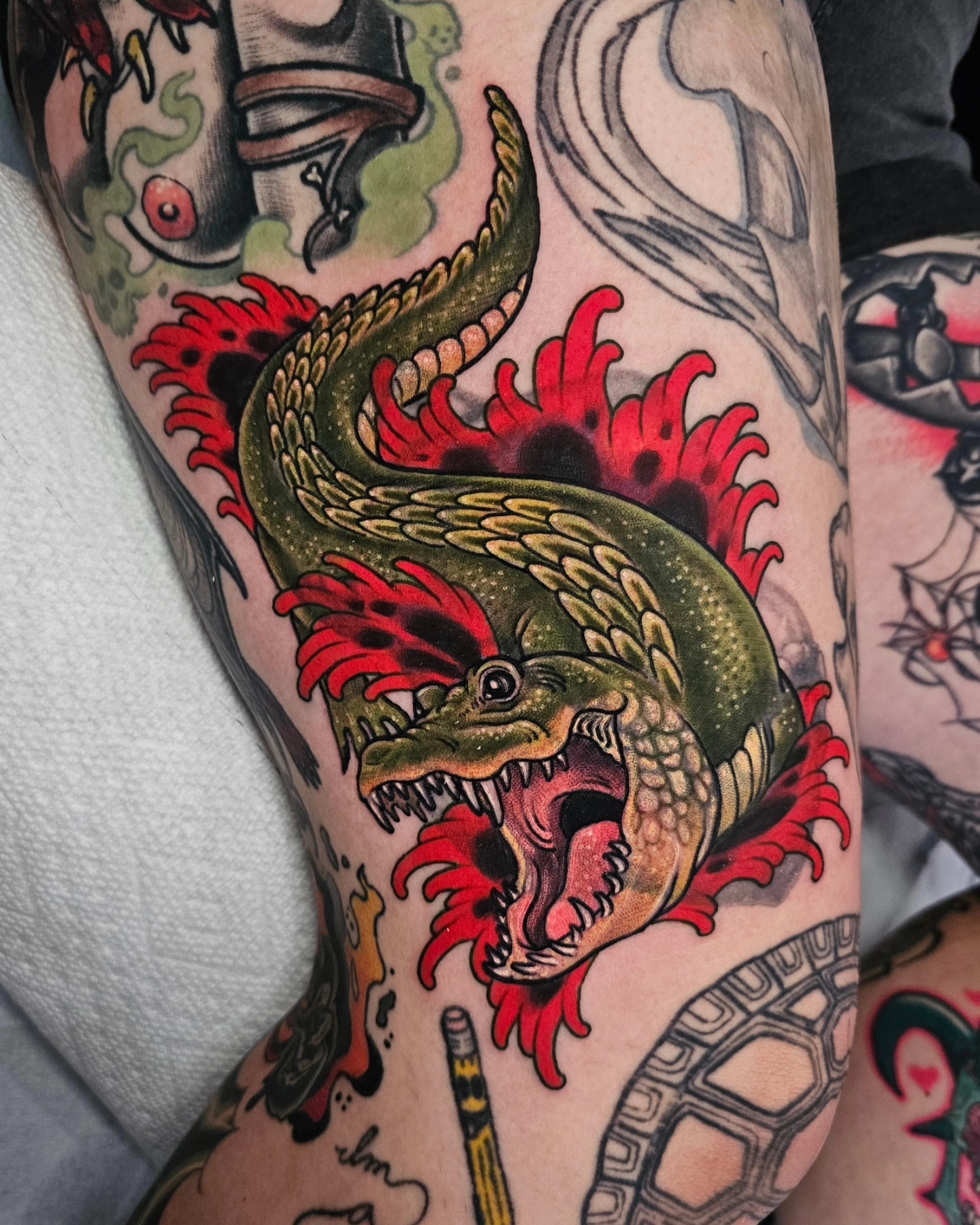 Serpent American traditional tattoo on the forearm by Shannon