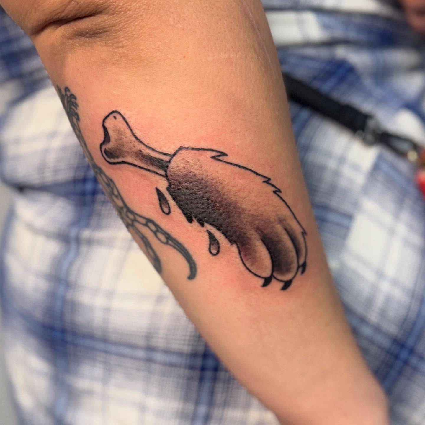 Bear paw black and grey tattoo on the forearm by Ashley Rose - Minnesota Tattoo Artist