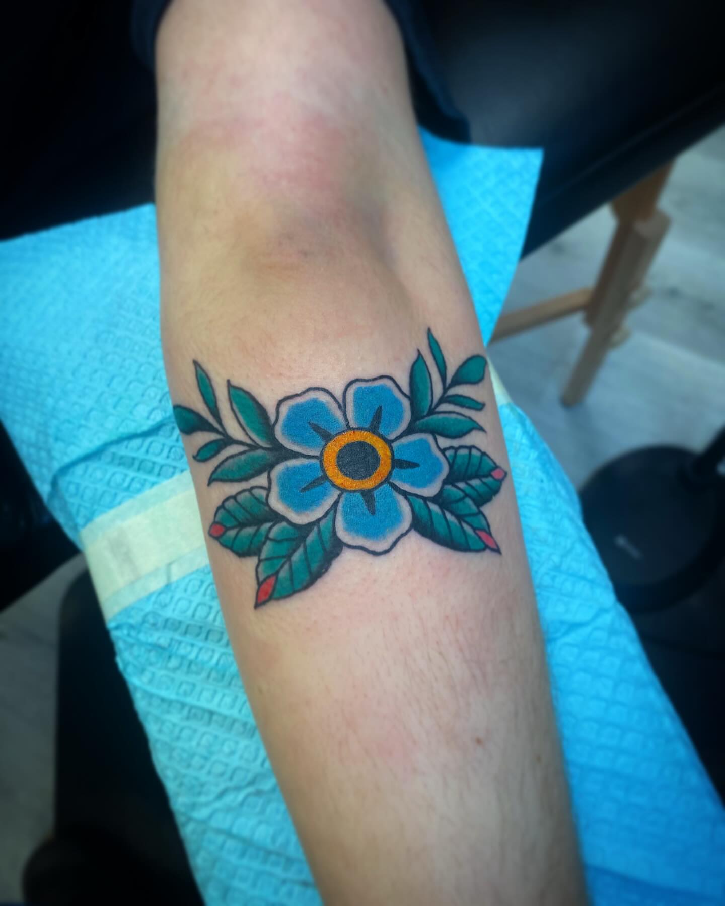 Flower American traditional tattoo on the forearm by Kyle Mitchell, Cincinnati
