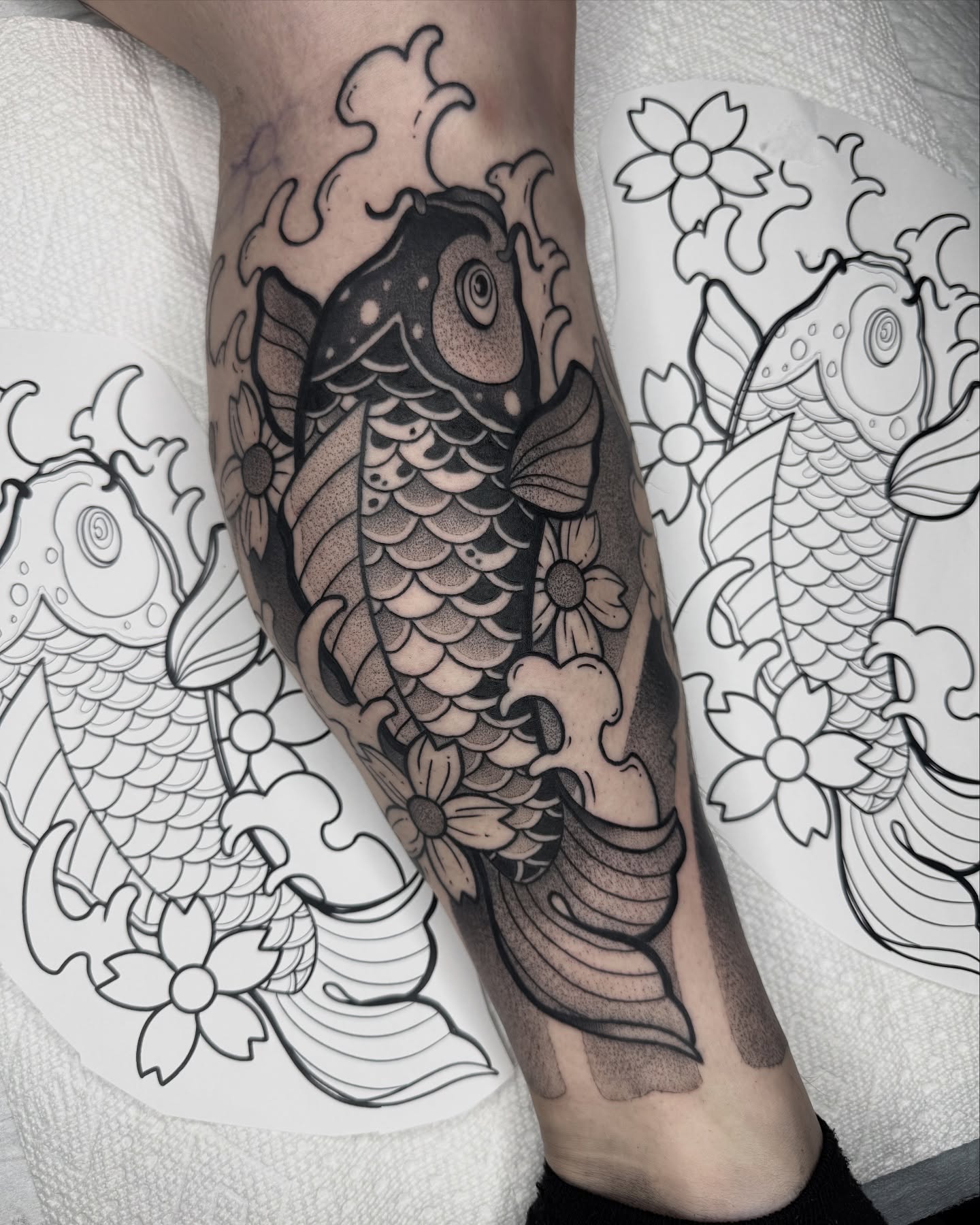 Koi fish dotwork tattoo on the forearm by Donnie Moore