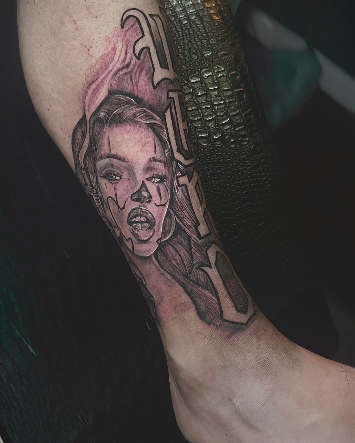 Woman's face realism tattoo on the forearm by Ken West
