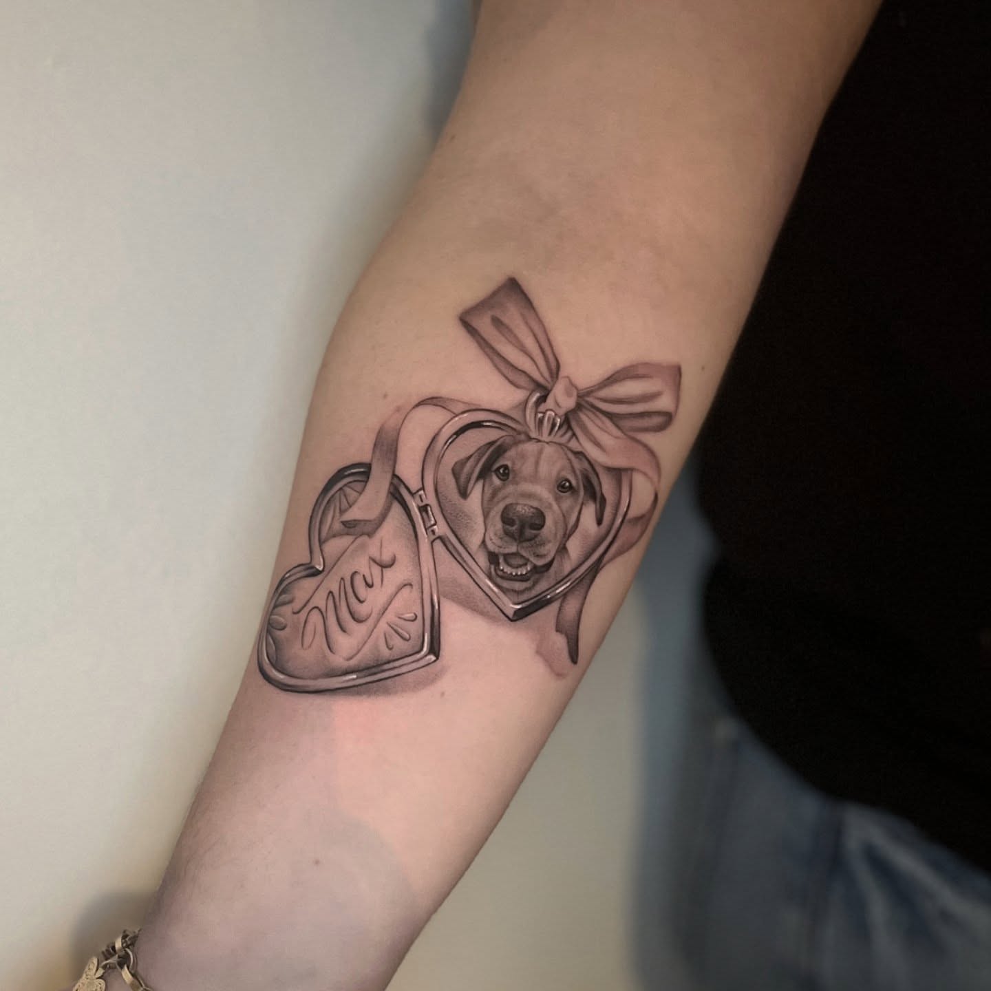 Dog in heart realism tattoo on the forearm by Lynx, Cincinnati, Ohio