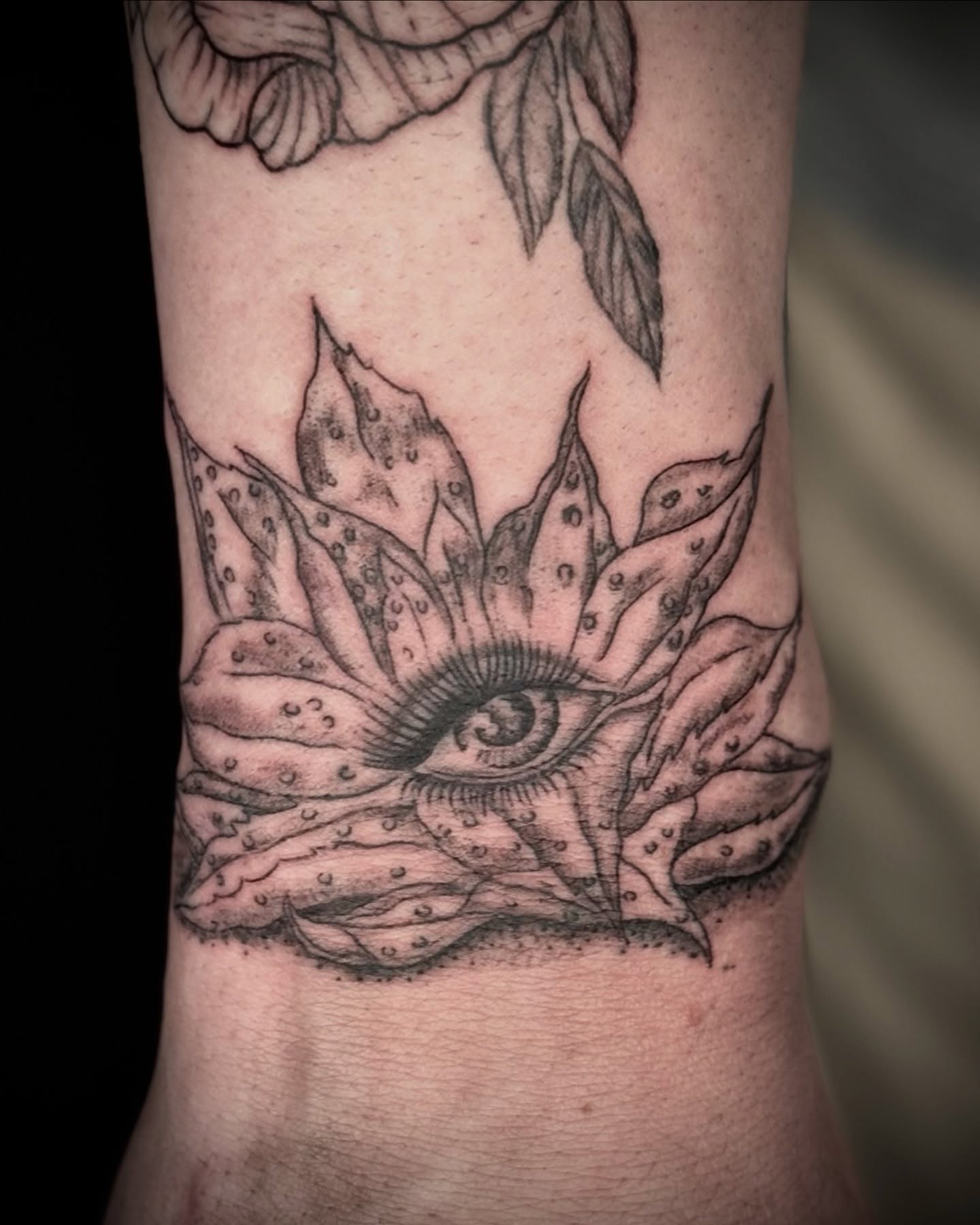 Eye with lotus dotwork tattoo on the forearm by Tattoos by Marcy
