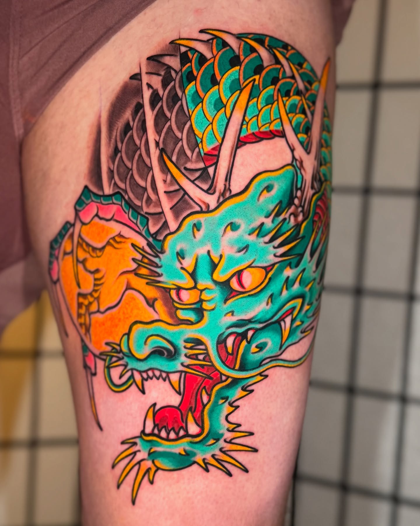 Dragon American traditional tattoo on the thigh by Mario Arcila