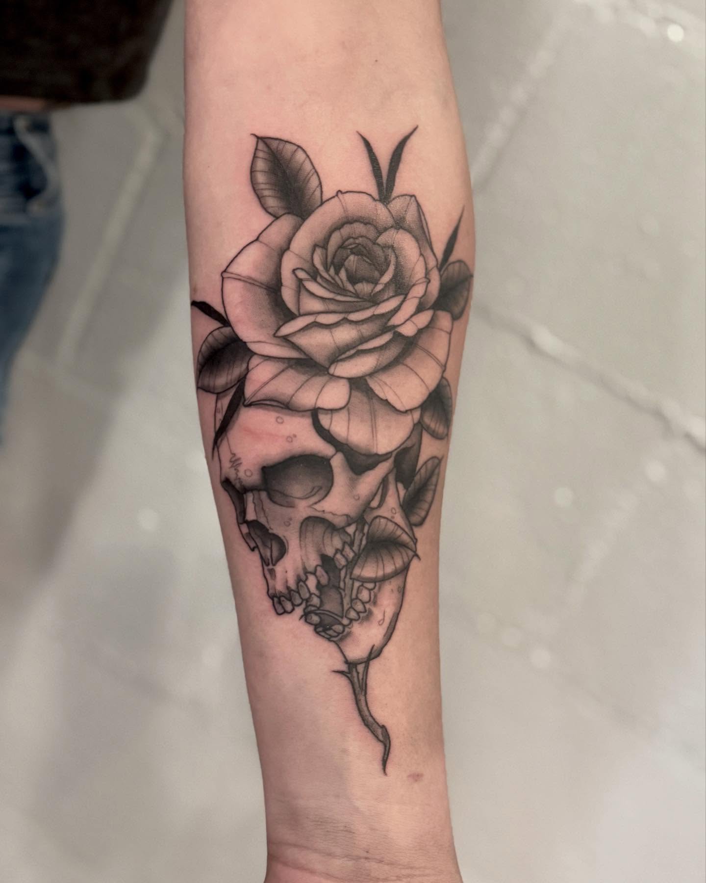 Rose and skull realism tattoo on the forearm by Drew Foster, Toledo, Ohio