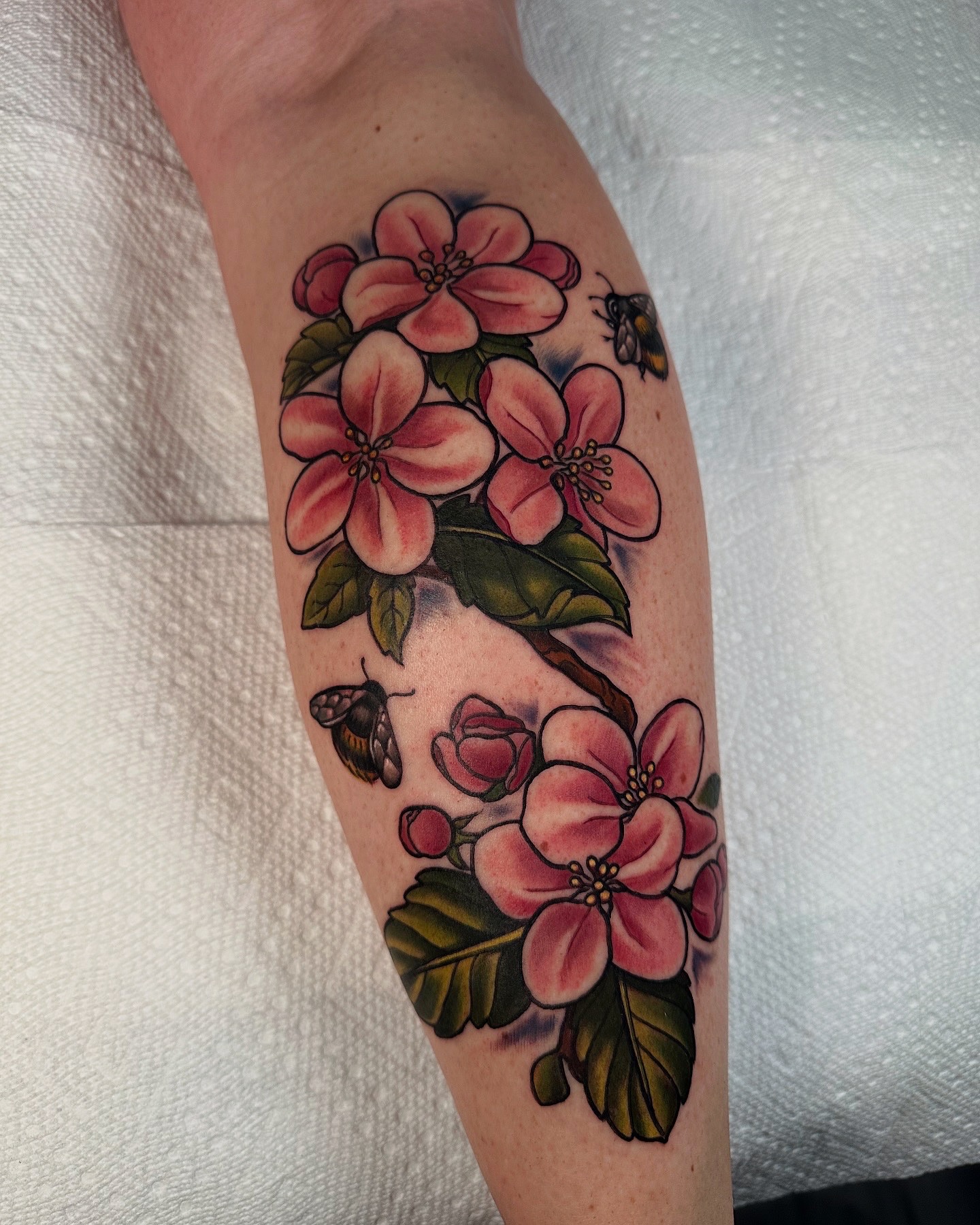 Cherry blossoms and bees American traditional tattoo on the forearm by ✨Sarah Knapp✨, Eugene, Oregon