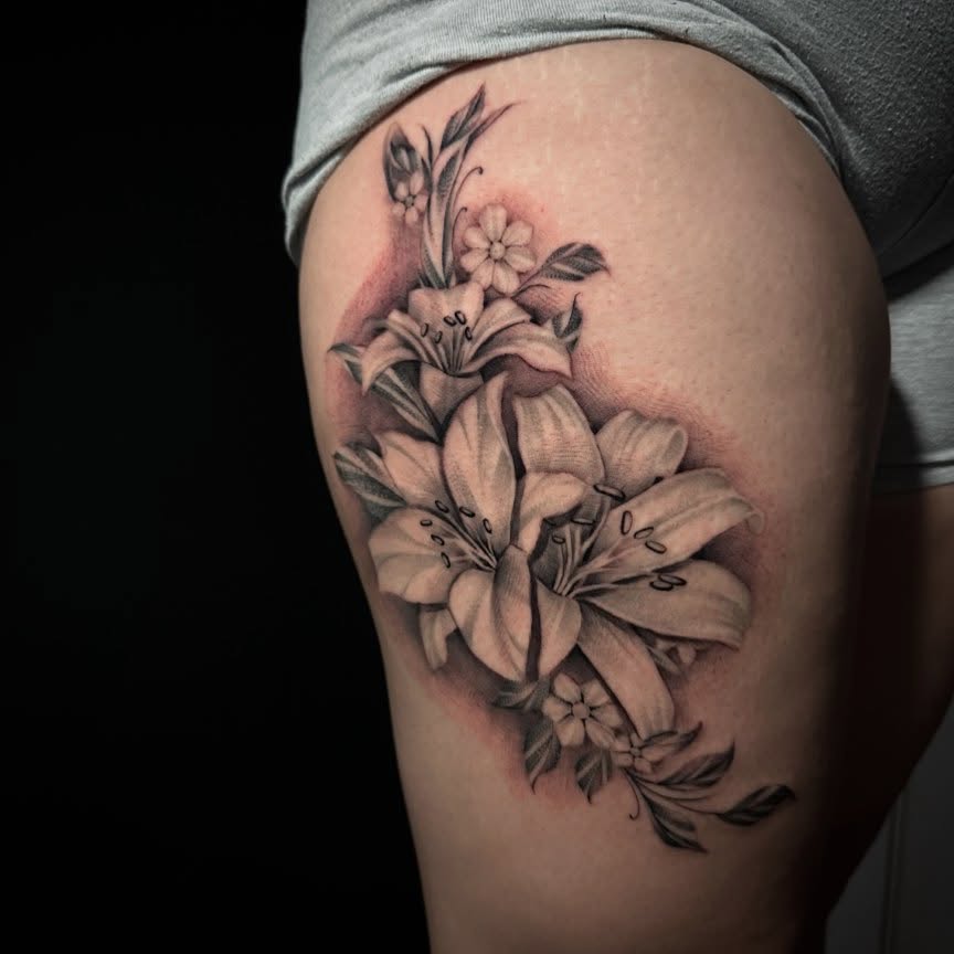 Lilies realism tattoo on the thigh by "CAM", West Palm Beach, Florida