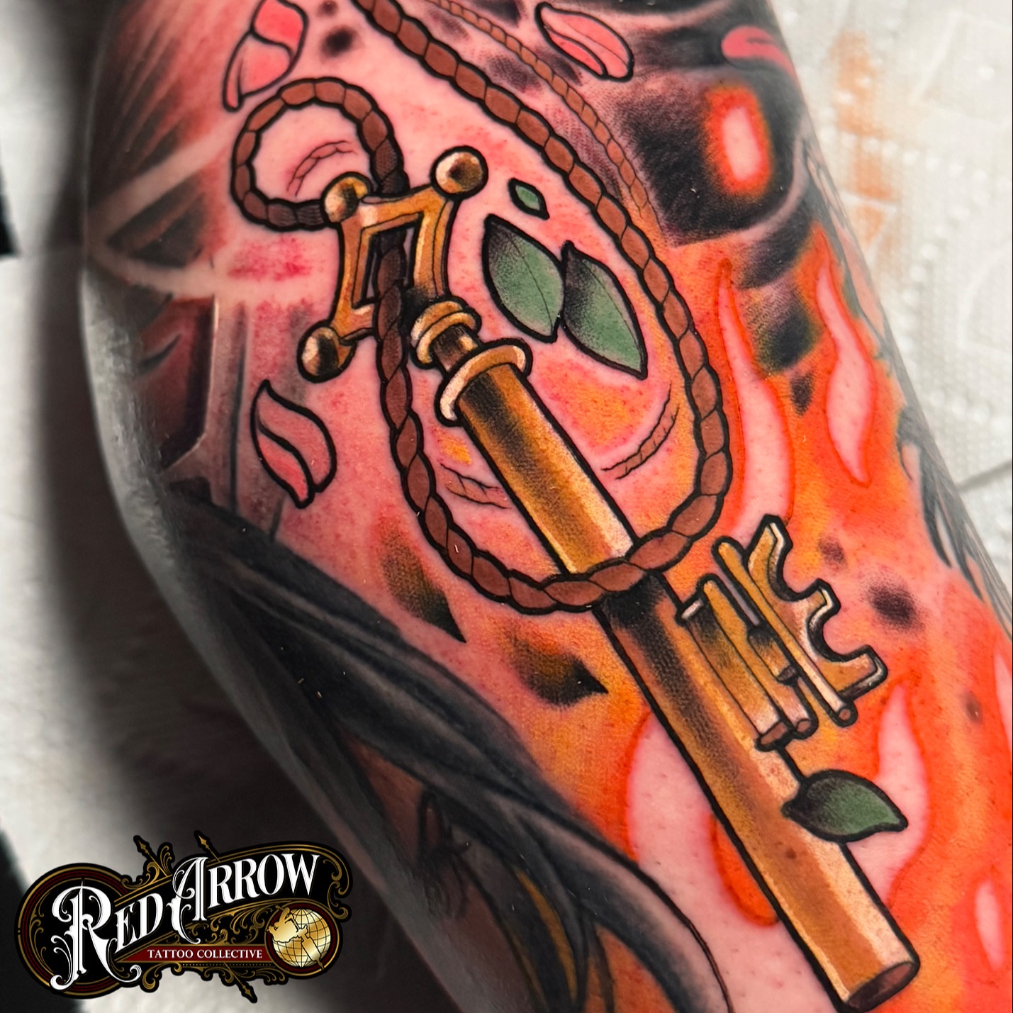 Key with rope American traditional tattoo on the forearm by 𝕽𝖊𝖉 𝕬𝖗𝖗𝖔𝖜 𝕿𝖆𝖙𝖙𝖔𝖔 𝕮𝖔𝖑𝖑𝖊𝖈𝖙𝖎𝖛𝖊, Troy, Michigan