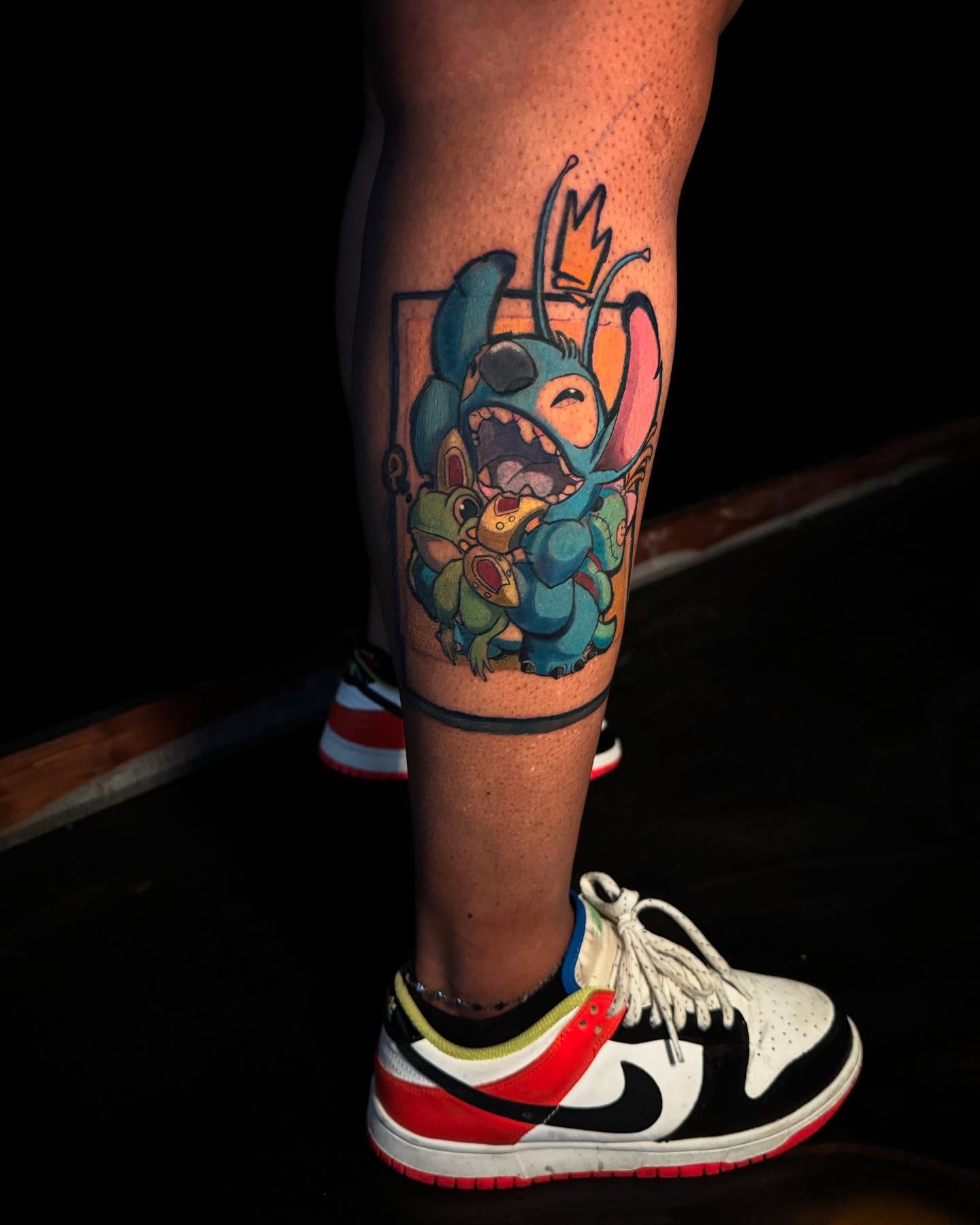 Stitch and angel new school tattoo on the calf by Anthony Washington, Atlanta, Georgia