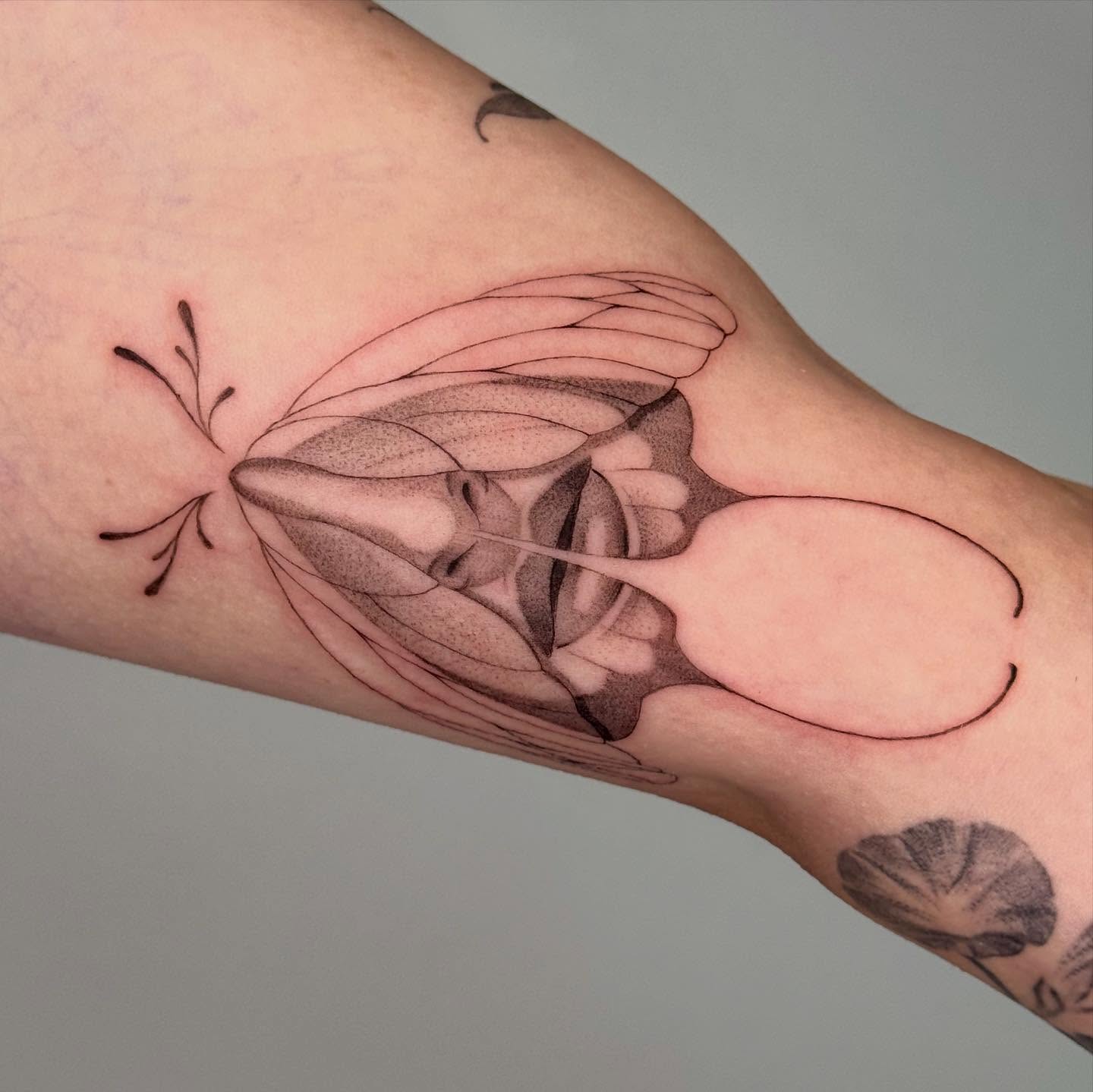 Abstract form black and grey tattoo on the forearm by Alyssa . Villela