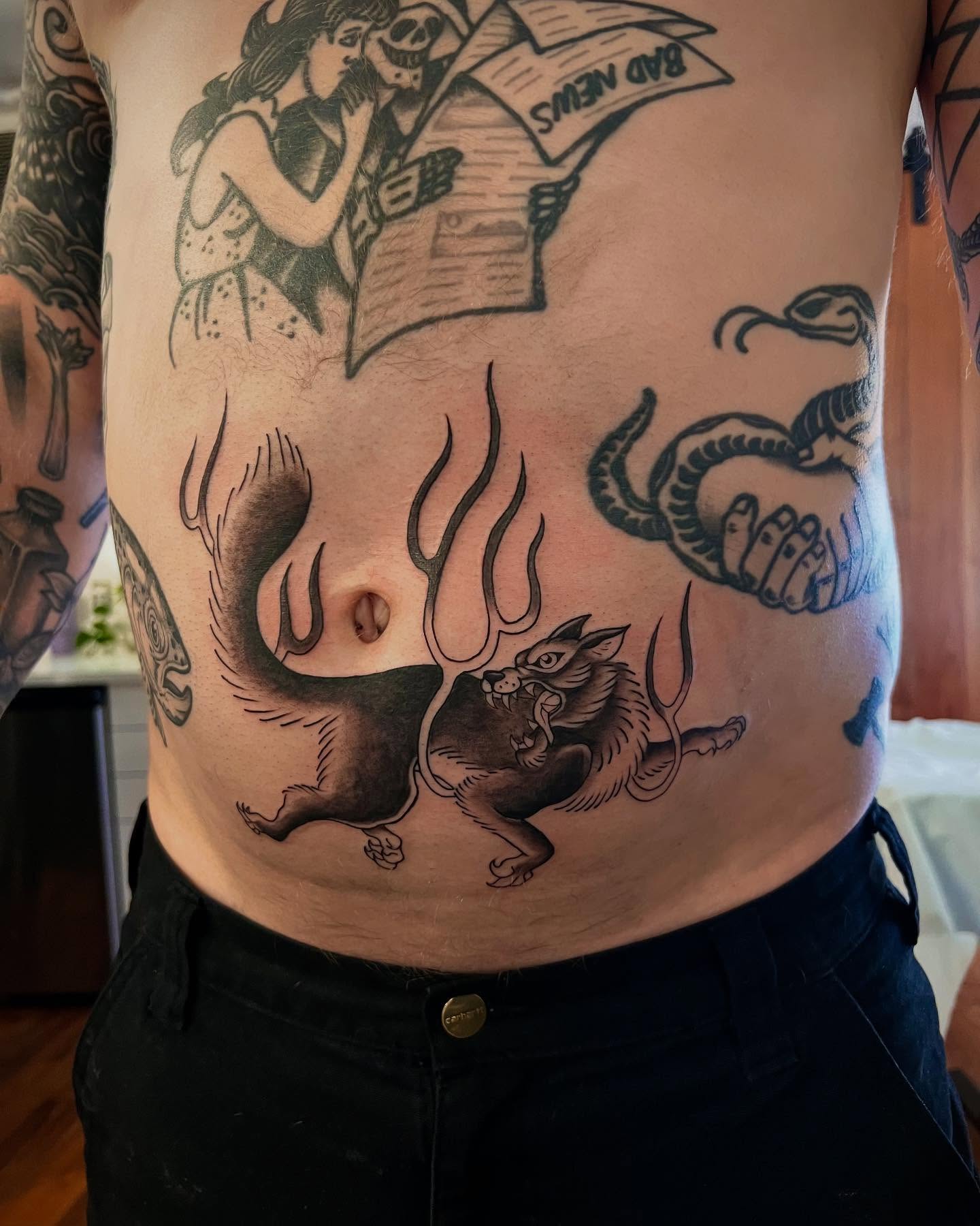 Wolf and stag American traditional tattoo on the torso by Tasha Venola, Bellingham, Washington