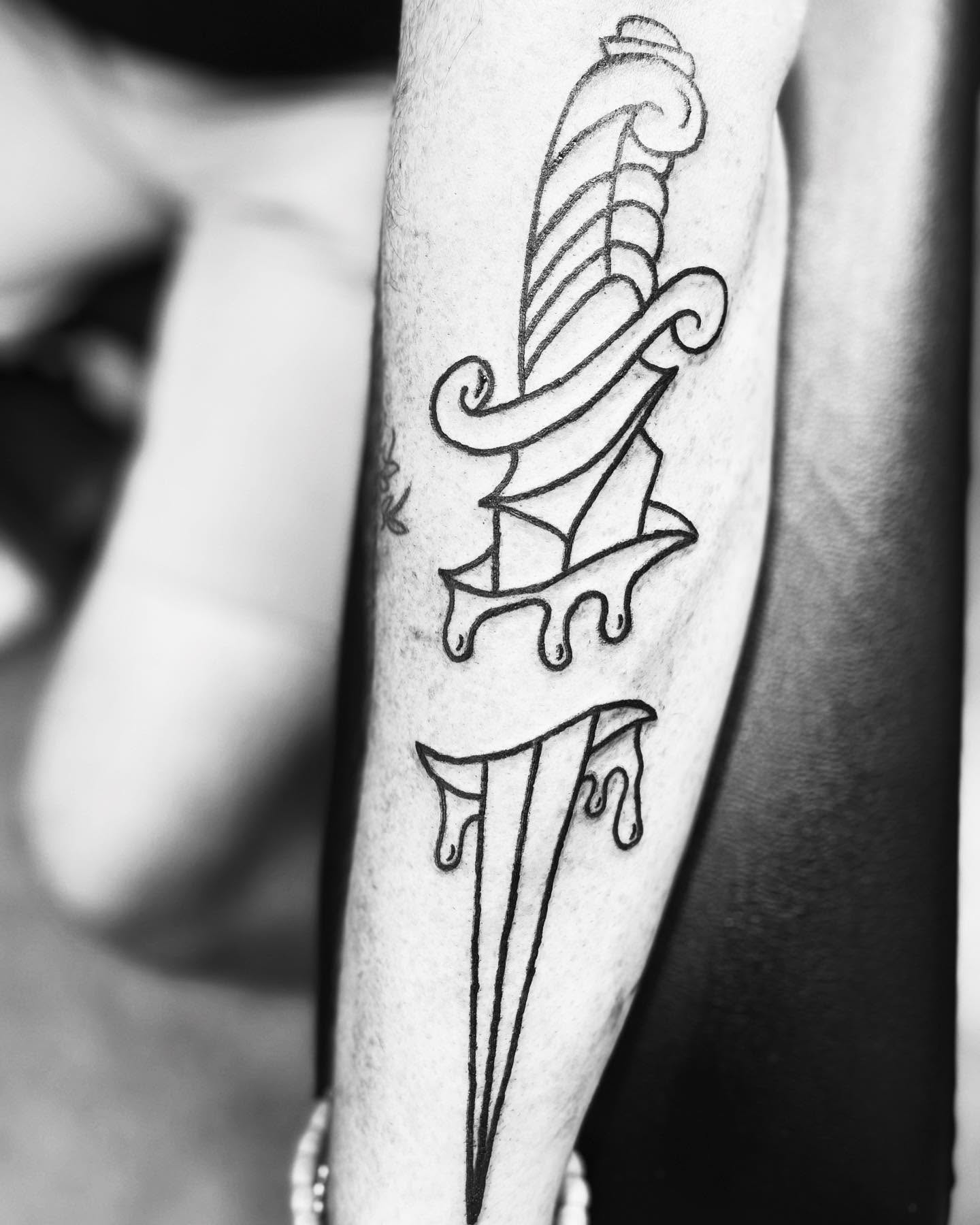 Sword and ribbon geometric tattoo on the forearm by Alesia
