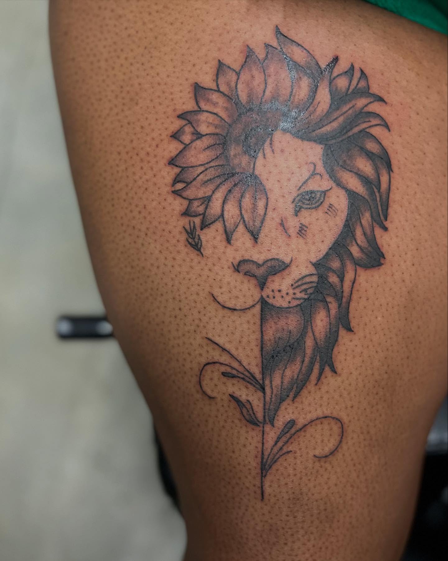 Sunflower lion dotwork tattoo on the thigh by Alesia