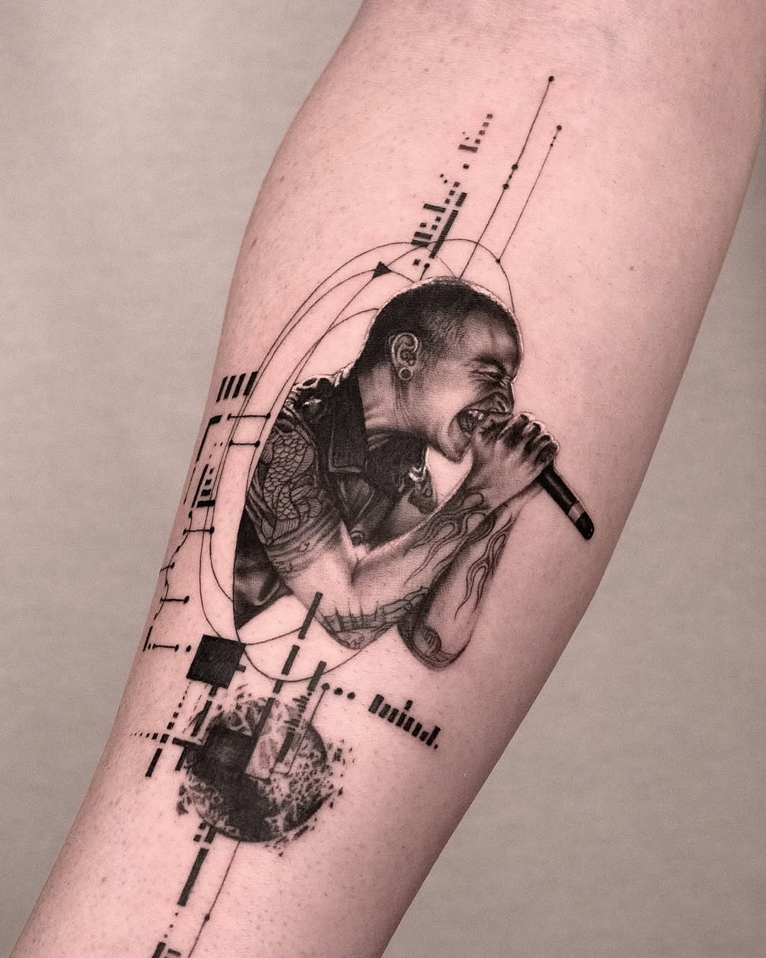 Singer with microphone realism tattoo on the forearm by János Bozóki, Budapest, Hungary