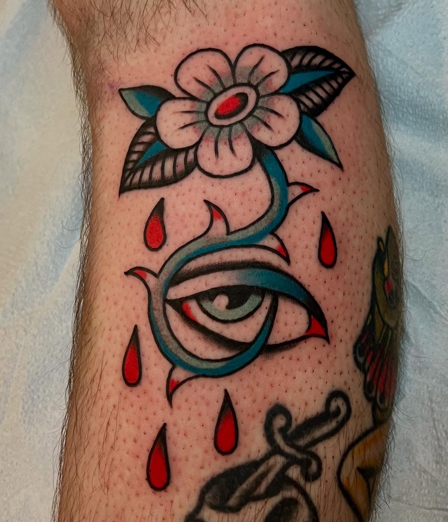 Tearful eye with flower American traditional tattoo on the forearm by Liv :)