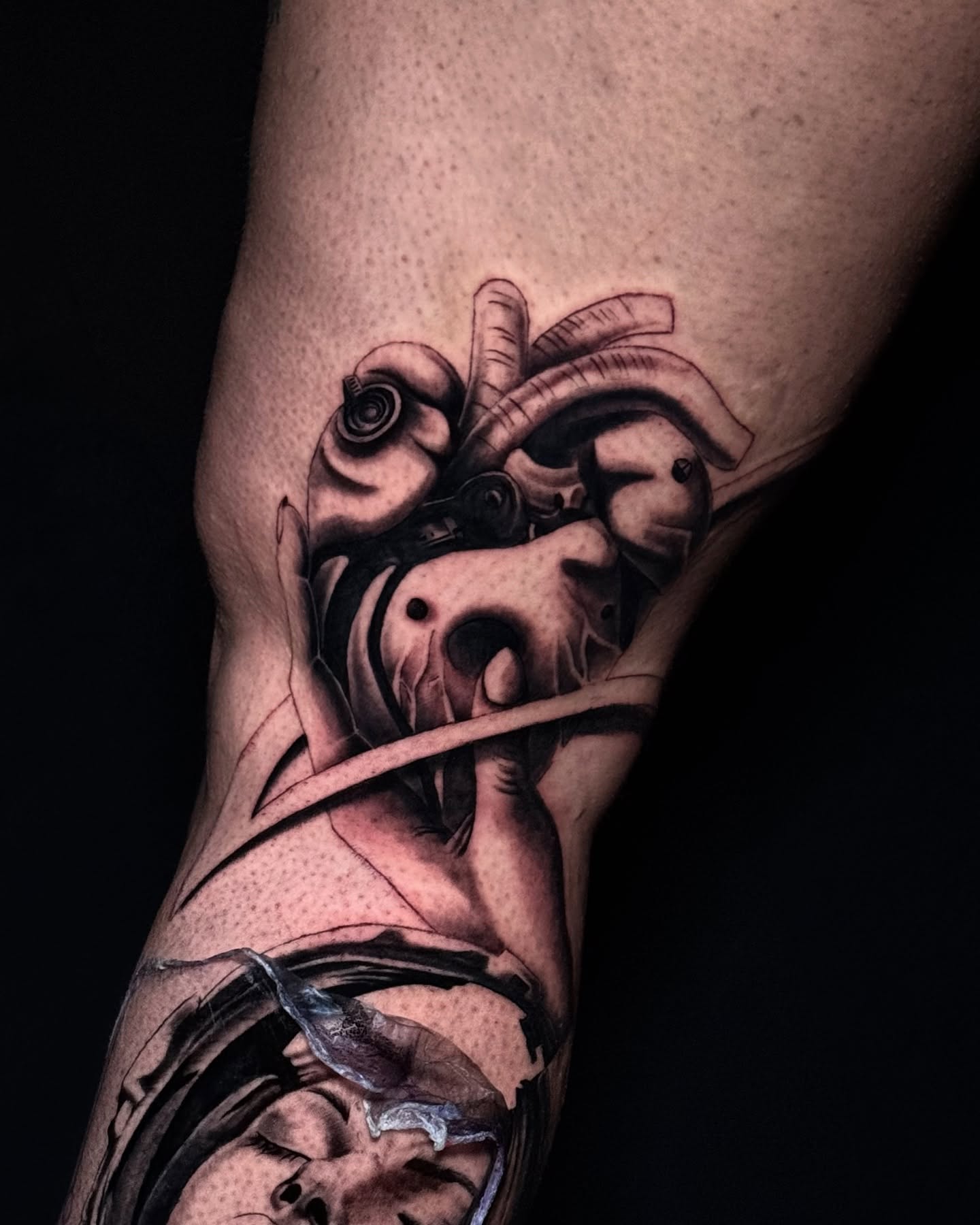 Abstract creature dark realism tattoo on the forearm by Dori