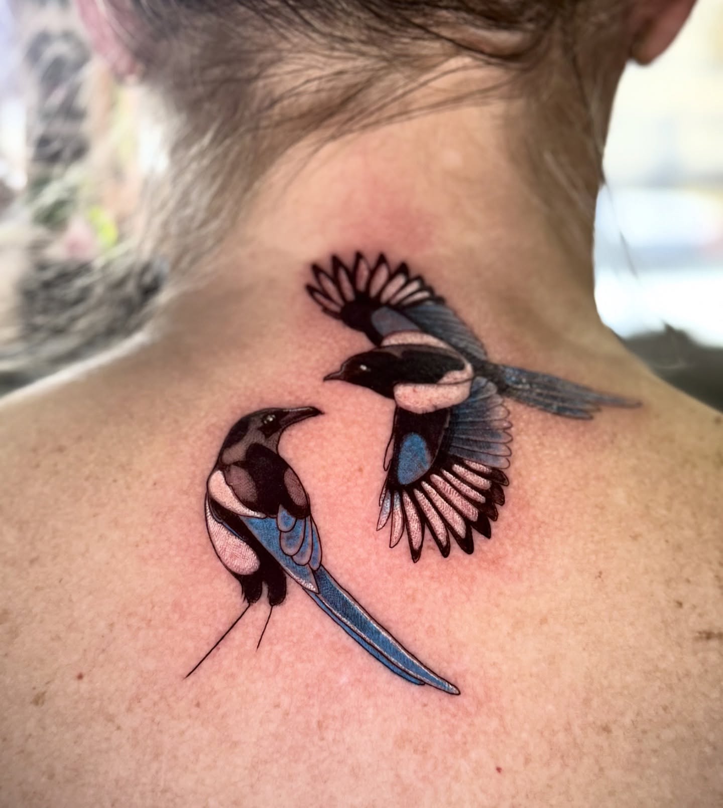 Birds realism tattoo on the back by Lydia Jude