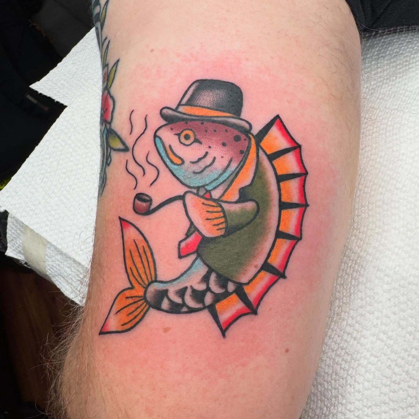 Fish smoking pipe American traditional tattoo on the forearm by Zach Gonzalez, Austin, Texas