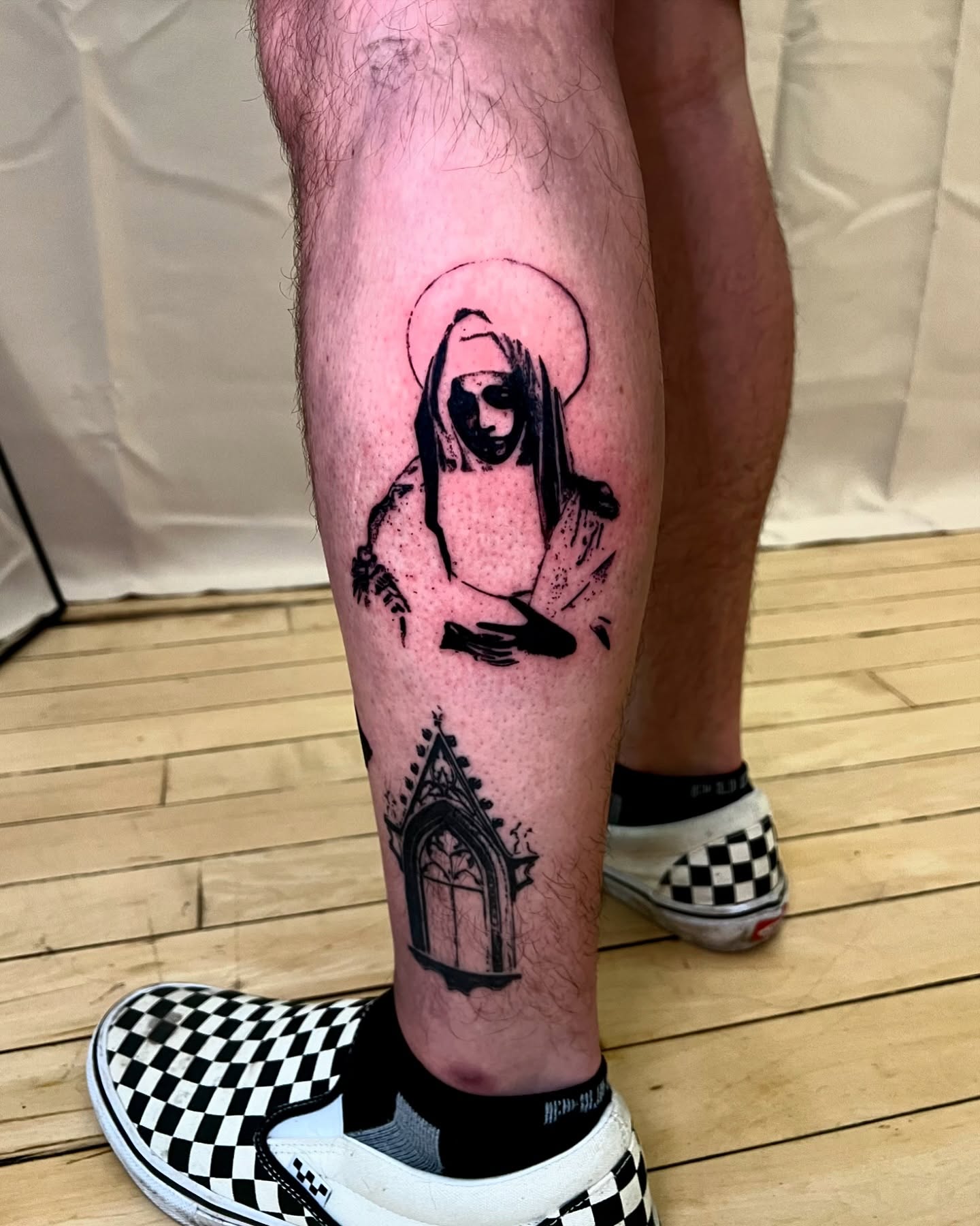 Religious figure realism tattoo on the calf by Maddy Paige