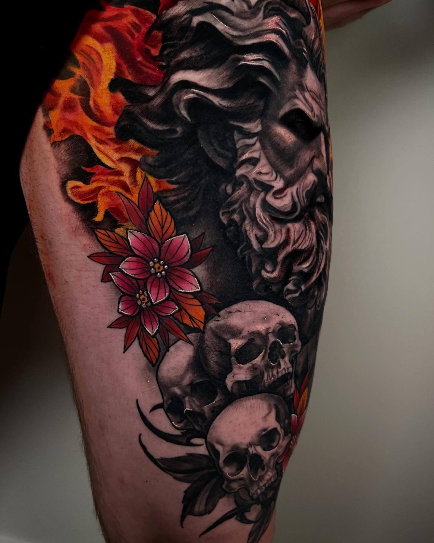 Flames, skull, flowers realism tattoo on the forearm by Claude Steven Estrada, Las Vegas, Nevada