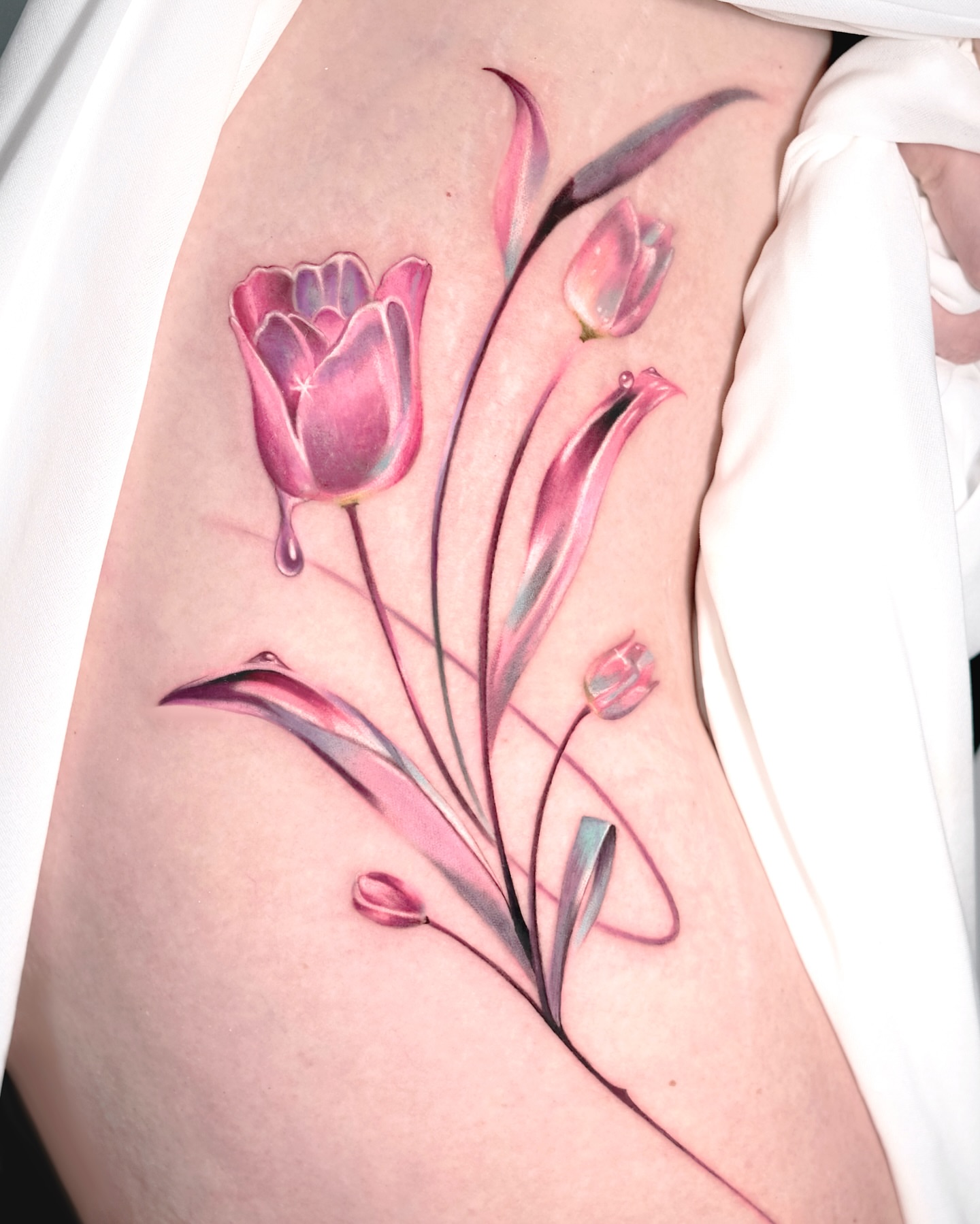 Tulips realism tattoo on the thigh by Cyber sigil & ornamental tattoo π₯