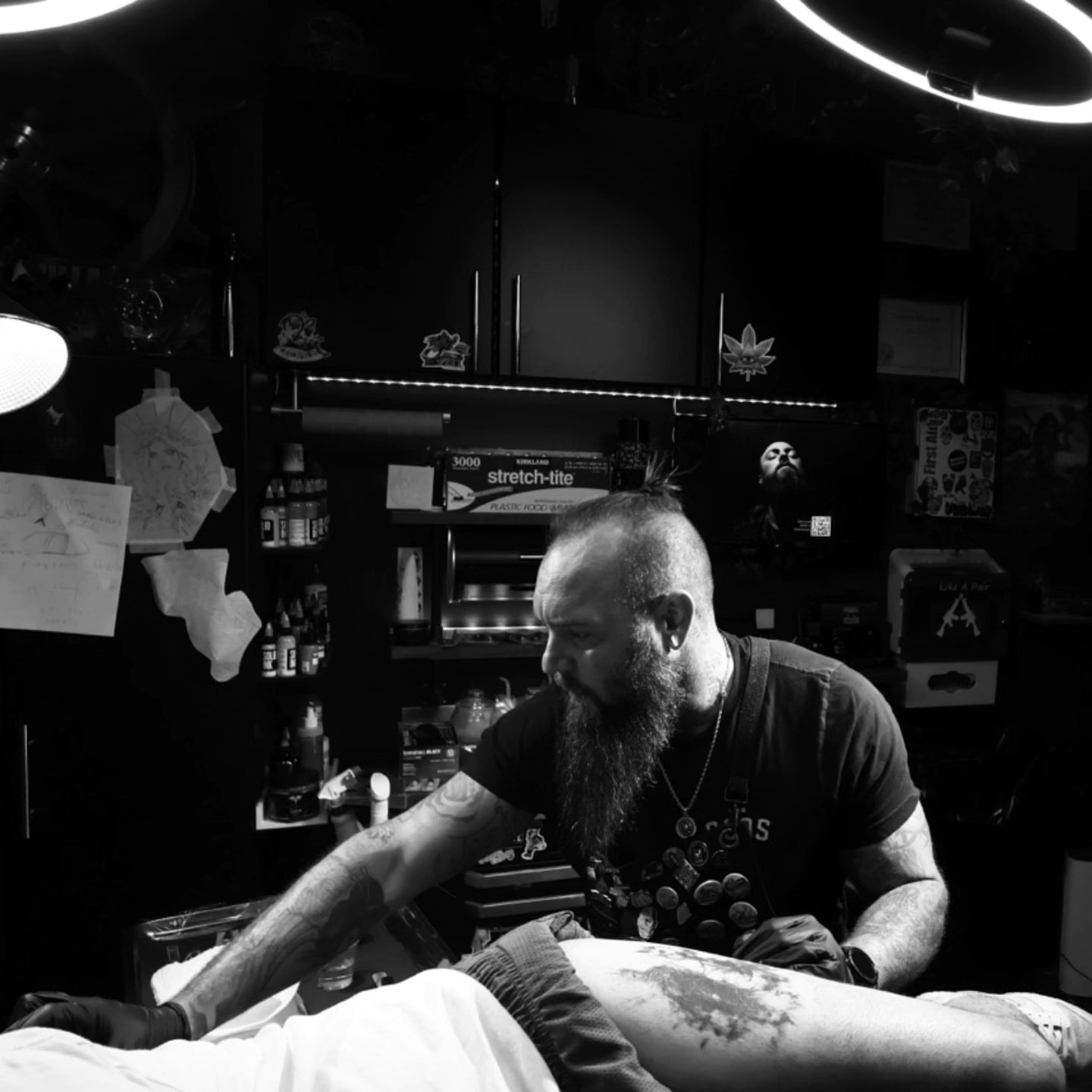 Bearded man black and grey tattoo on the upper arm by Jesse TheTerrible