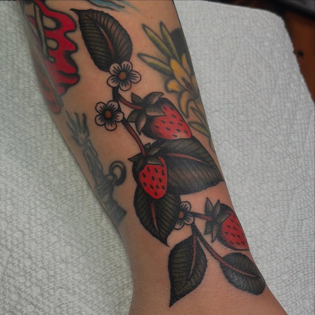 Strawberries and leaves neo-traditional tattoo on the forearm by @ryleecoyote, New York, New York
