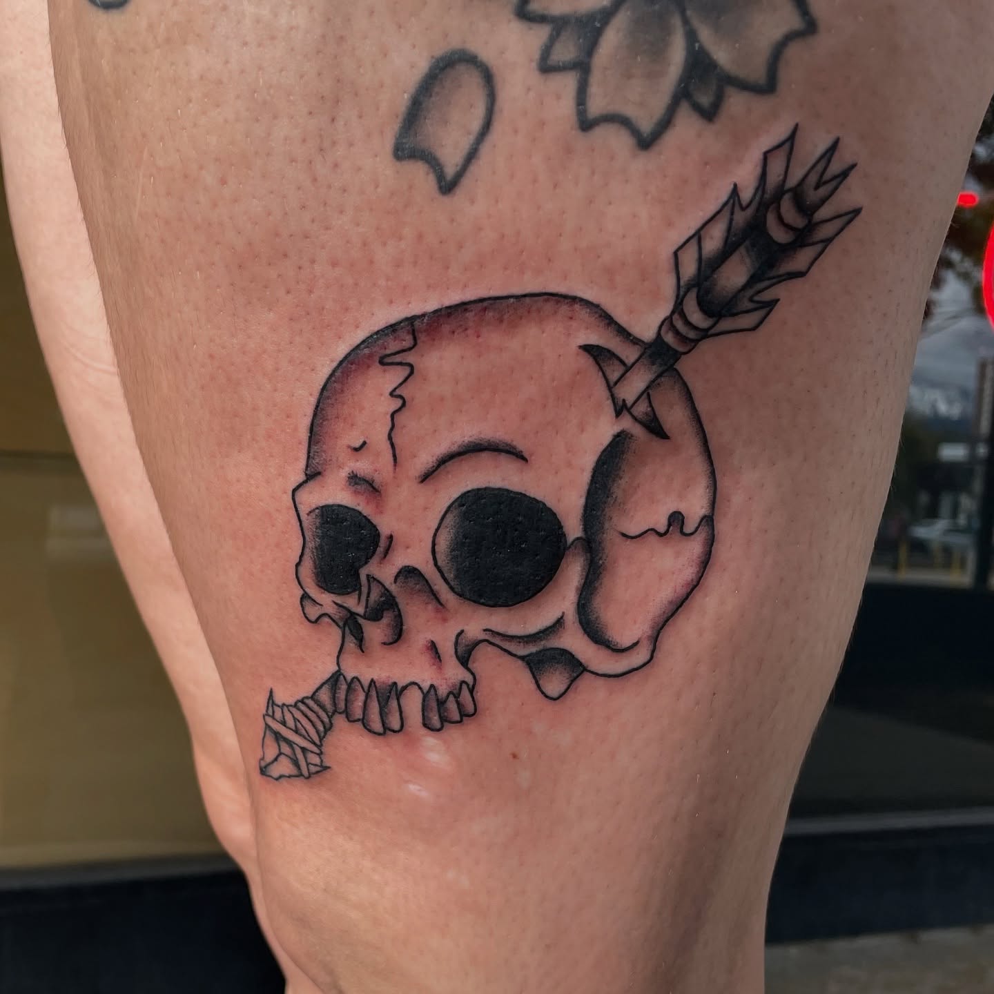 Skull with arrow black and grey tattoo on the thigh by Cam TallBoy SLC Tattoo Artist, Salt Lake City, Utah