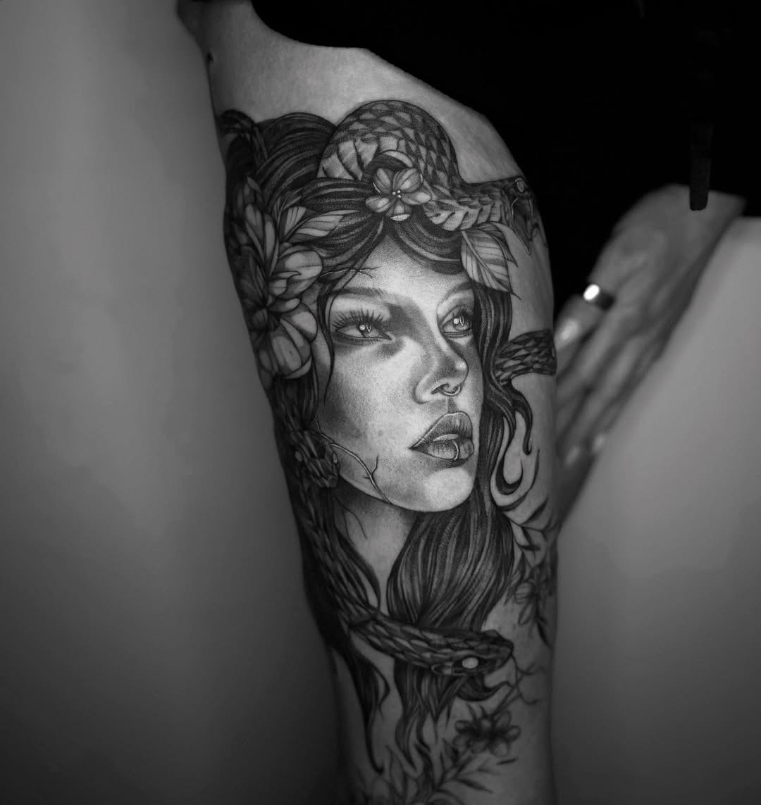 Woman with snake and flowers realism tattoo on the forearm by Isabelle Kellar, San Diego, California
