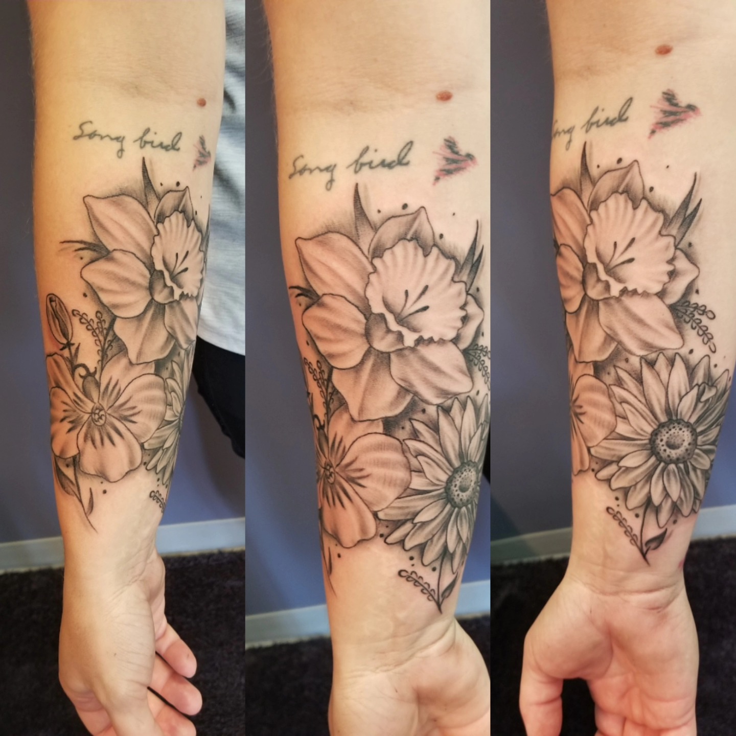 Flowers and birds black and grey tattoo on the forearm by Dennis Foust