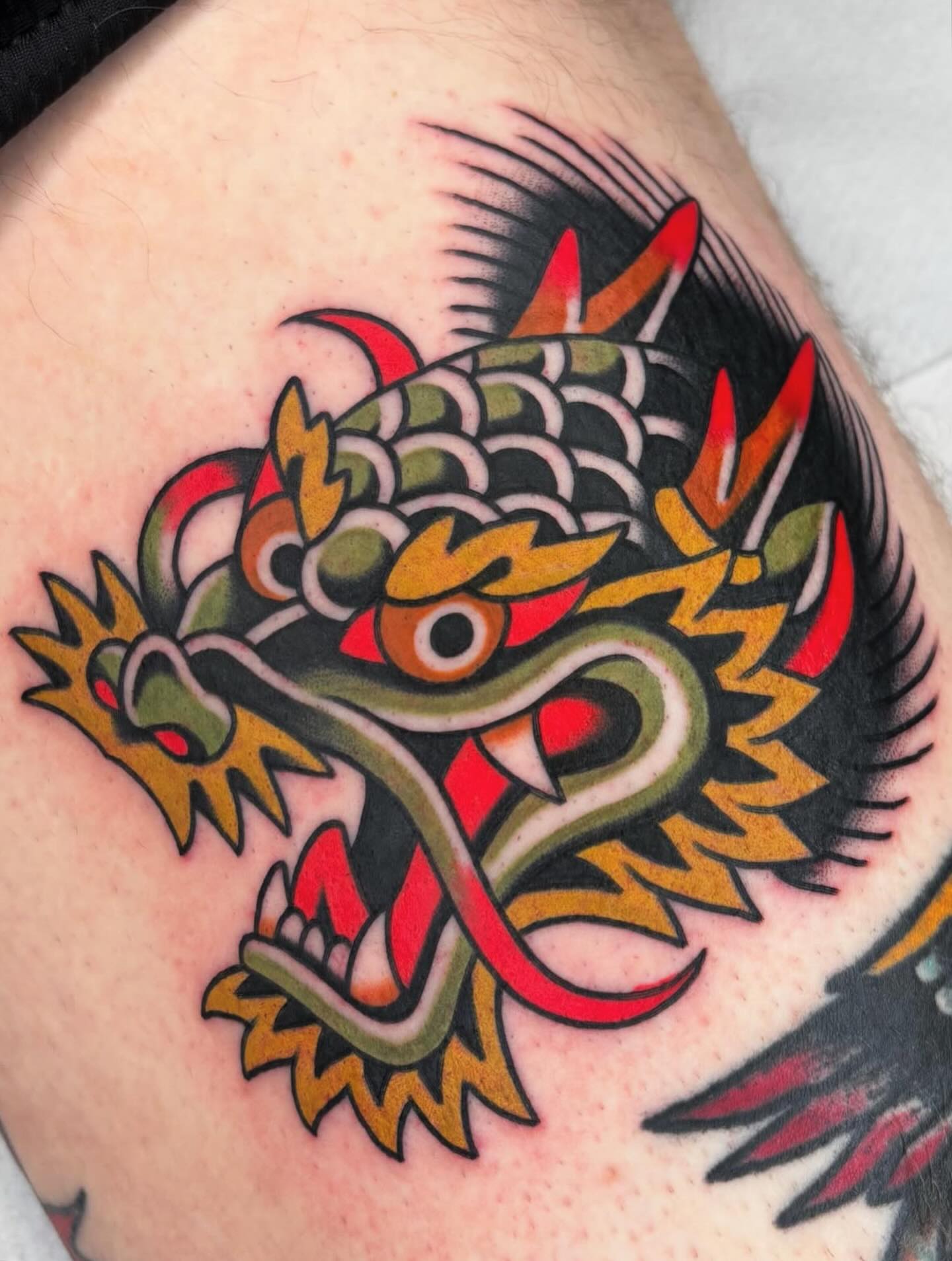Dragon American traditional tattoo on the thigh by Arturo Ledesma