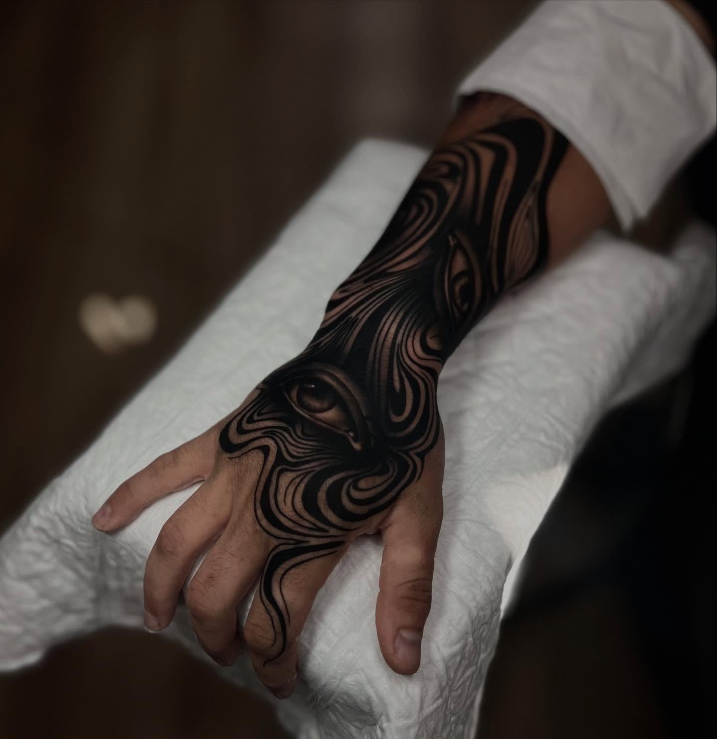 Abstract swirls geometric tattoo on the hand by Jess