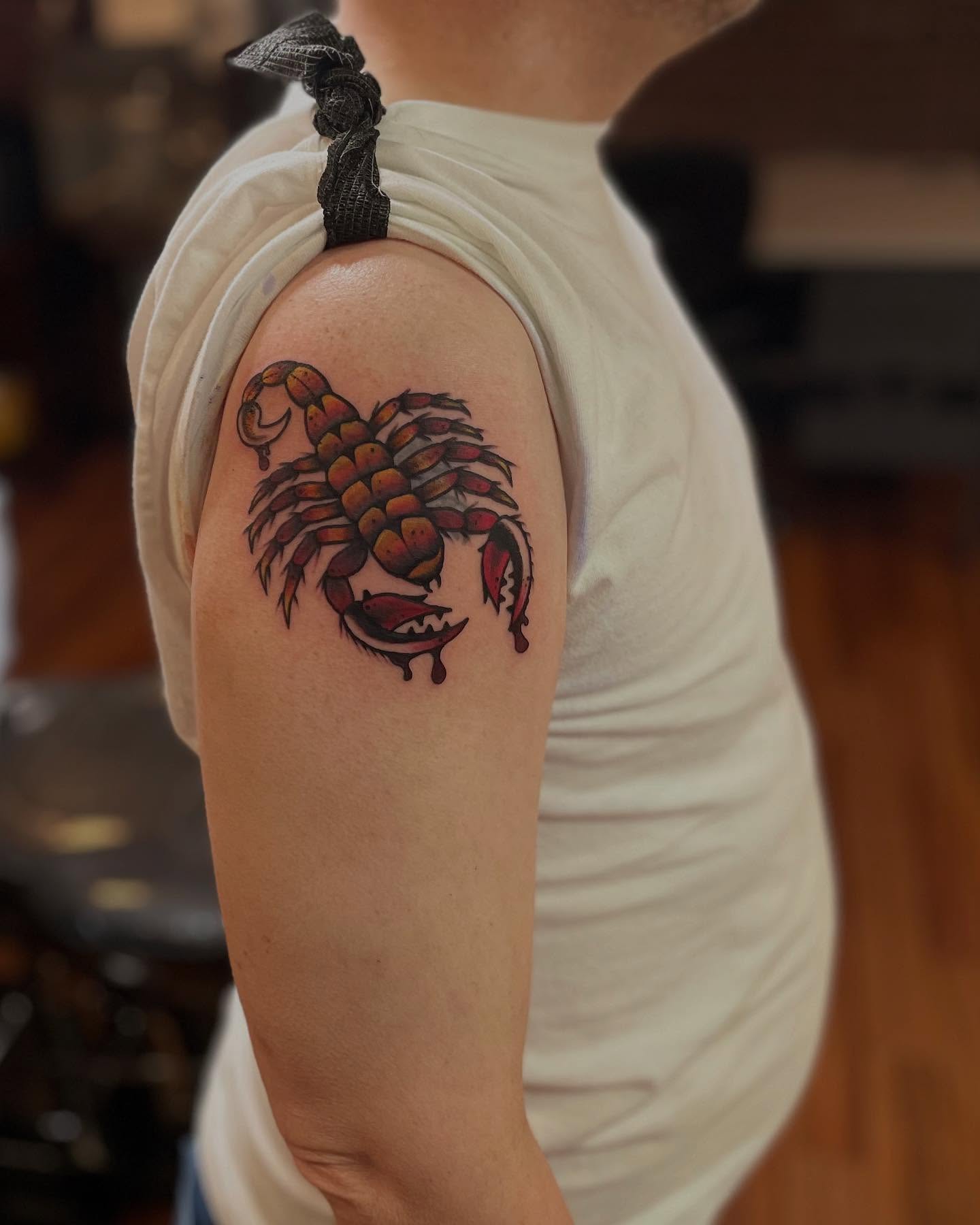 Scorpion American traditional tattoo on the upper arm by Anna sabrowsky