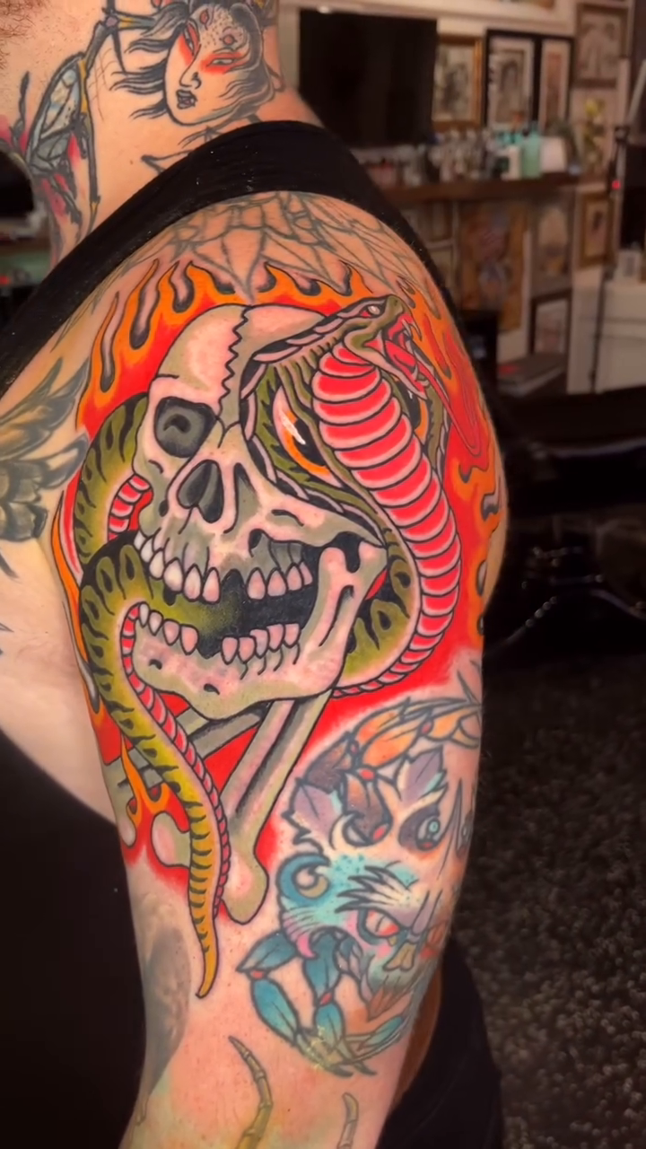 Skull and snake American traditional tattoo by Hayden Combs