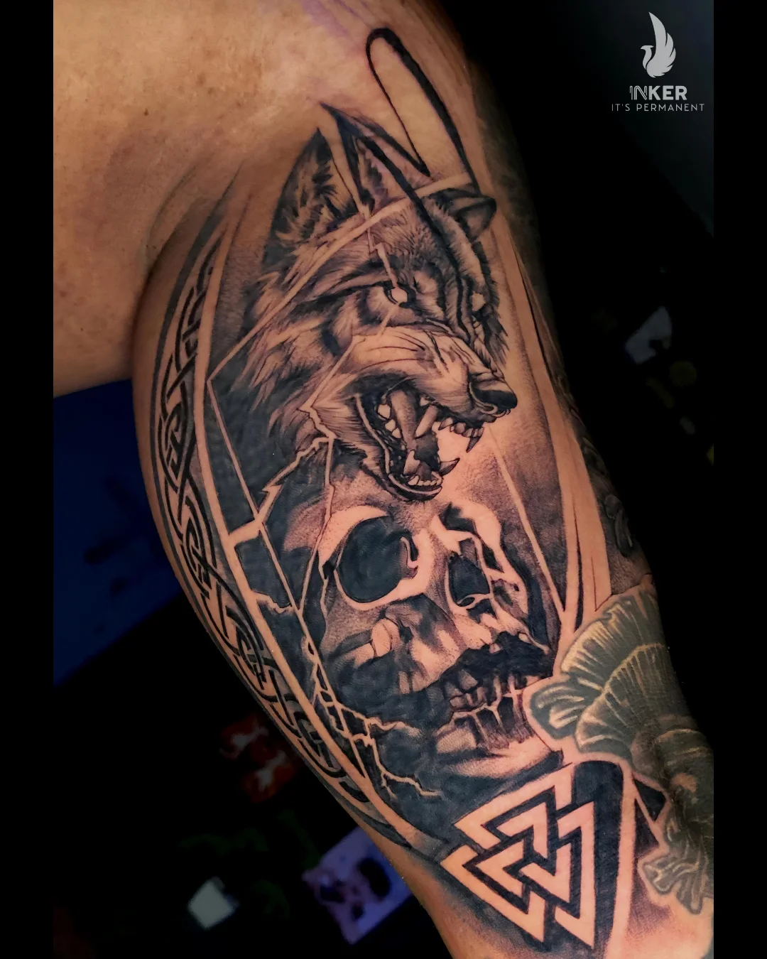 Wolf and skull realism tattoo on the shoulder by Shubhadeep Mukherjee