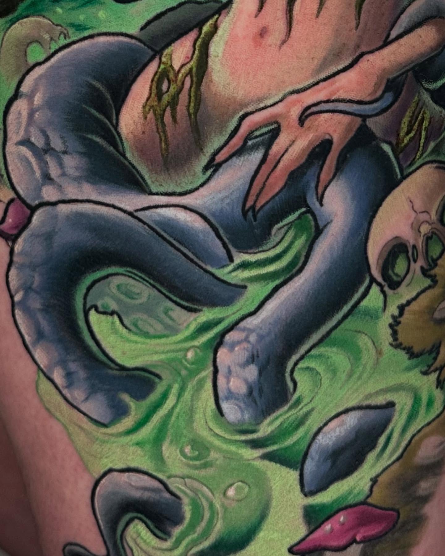Serpent and skull surrealism tattoo on the thigh by Zoe "Z" Fisk